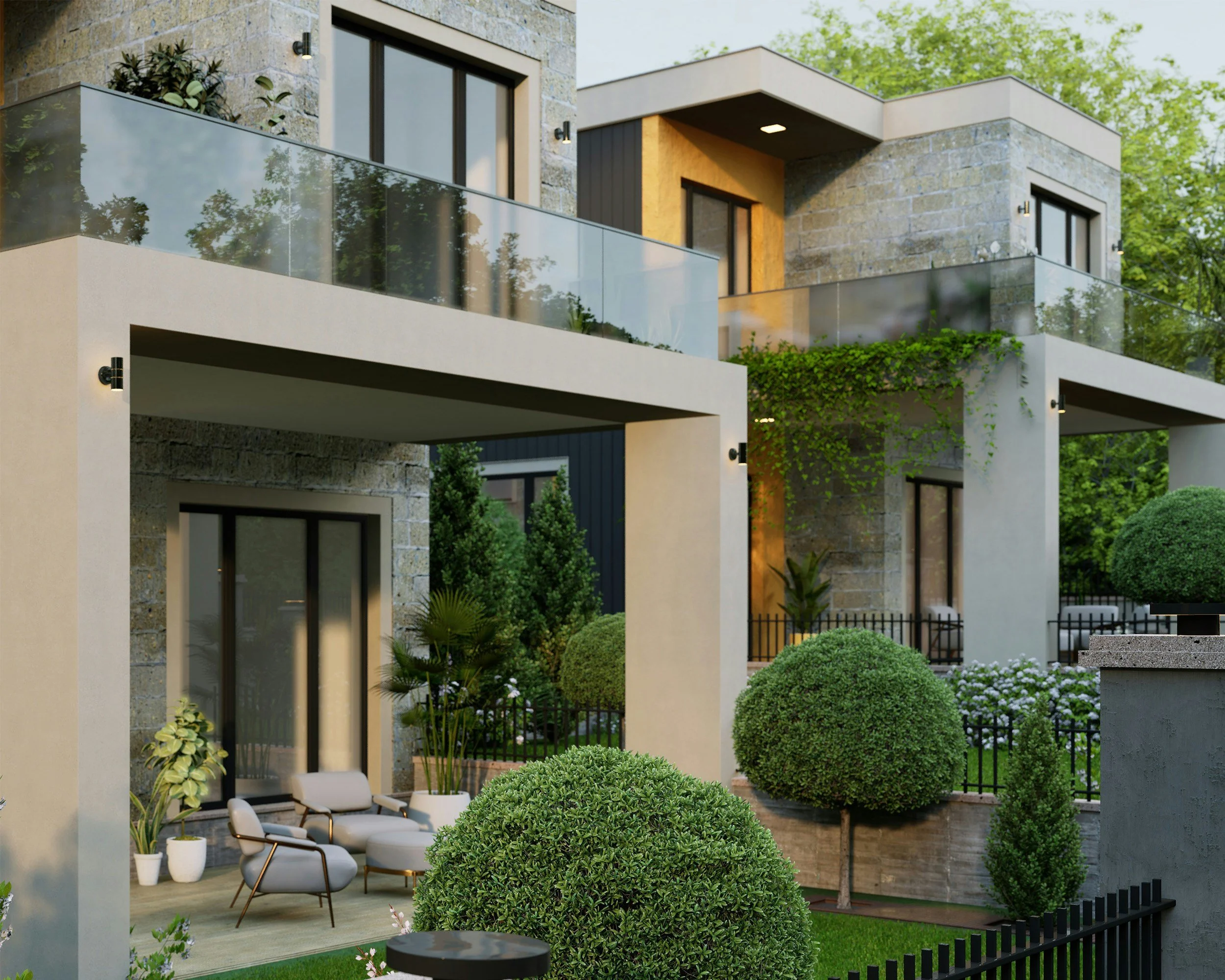 Modern multi-story residential building with stone and beige exterior, glass balcony railings, and surrounding landscaped garden with trimmed bushes, potted plants, and outdoor seating.
