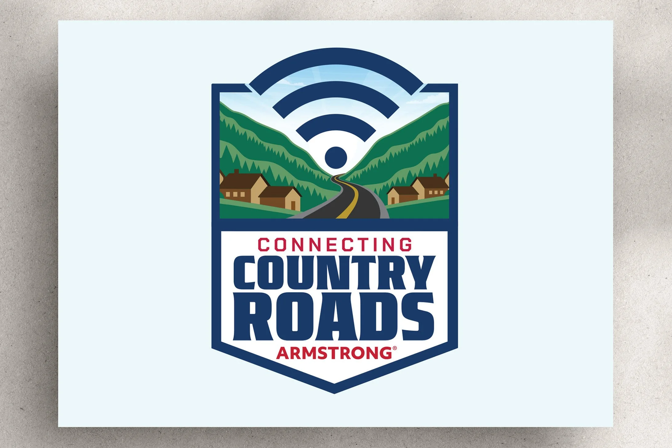 Sticker featuring a scenic mountain landscape with a winding road, houses, and a Wi-Fi symbol with radial lines, with the text "Connecting Country Roads" and "Armstrong" underneath.