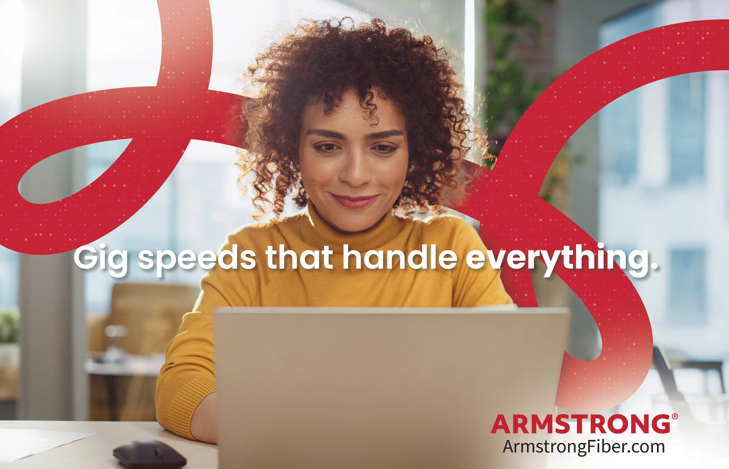 A woman with curly hair wearing a mustard yellow sweater sitting at a desk with a laptop, in front of a window, with a red abstract design overlay and white text that says "Gig speeds that handle everything". The Armstrong Fiber logo and website are at the bottom.