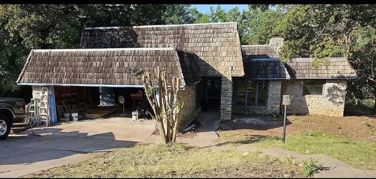 A wood shake and Flat roof house before it has been redone