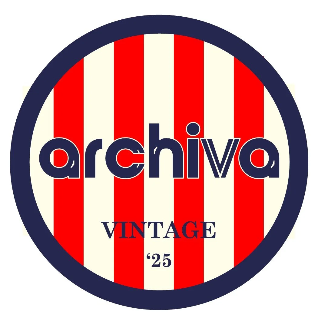 A circular vintage-style logo with red and white vertical stripes in the background. The word "archive" is written across the middle in large, dark blue letters, with "VINTAGE" and ''25" below it. A dark blue border surrounds the circle.