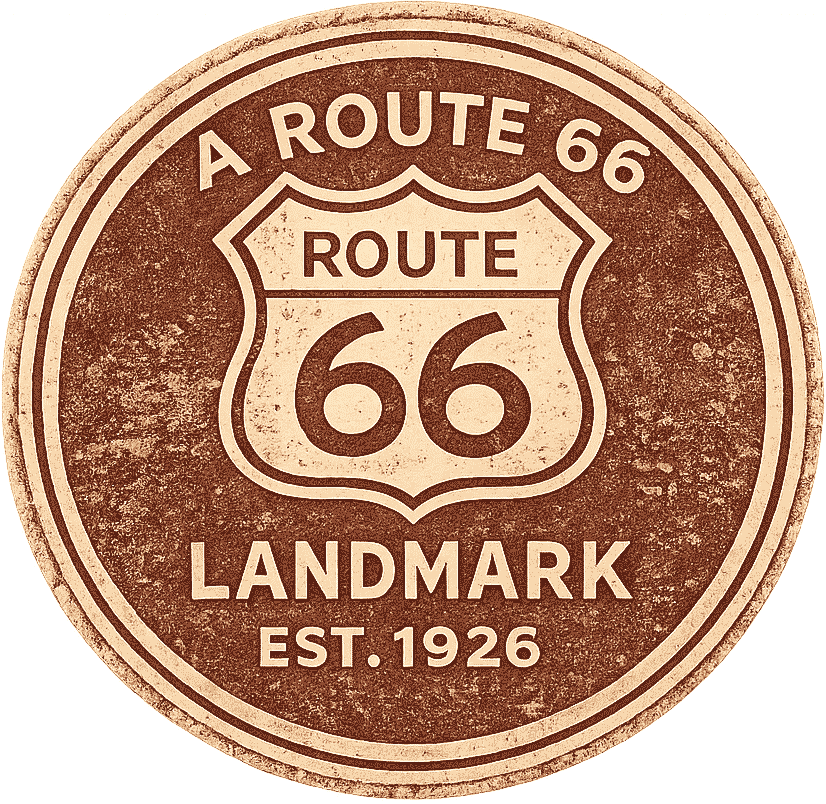 A vintage-style round sign for Route 66, indicating it is a landmark established in 1926.