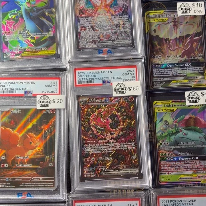Photo of Pokémon trading cards in protective cases, including Charizard Ex, Mew Ex, and Glaceon VSTAR.