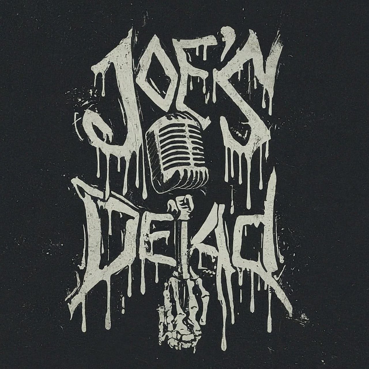 Graffiti-style artwork with a vintage microphone, a skull, and dripping text saying 'Lost in the Deep' on a black background.