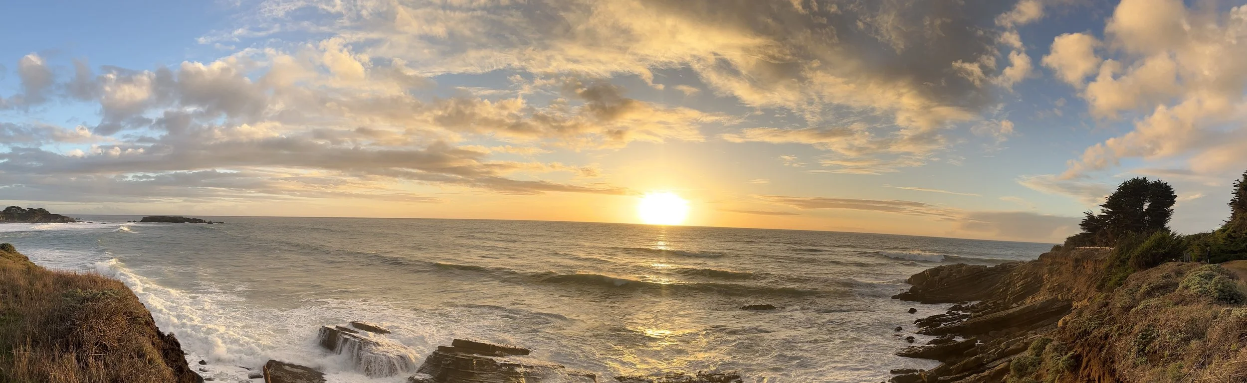 sunset over the pacific ocean taken from the Sea Ranch trail along the bluffs