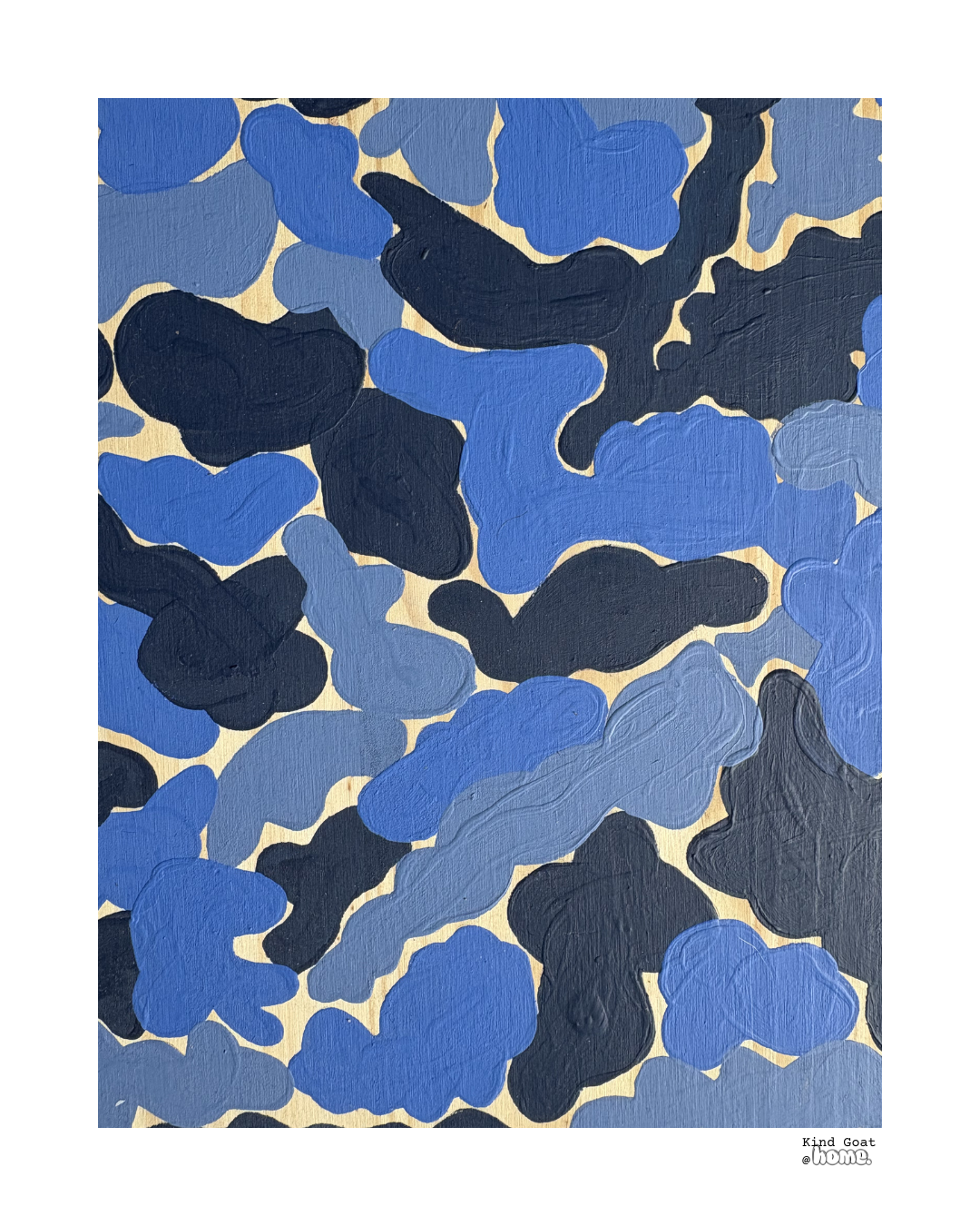 Abstract painting with blue, navy, and black irregular shapes on a beige background, with a small text at the bottom right corner that reads 'Kind Goat @home.'