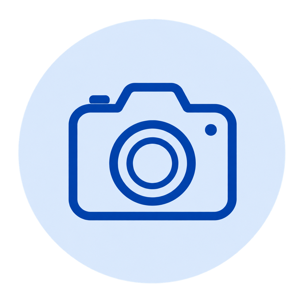 Icon of a camera on a circular light blue background.