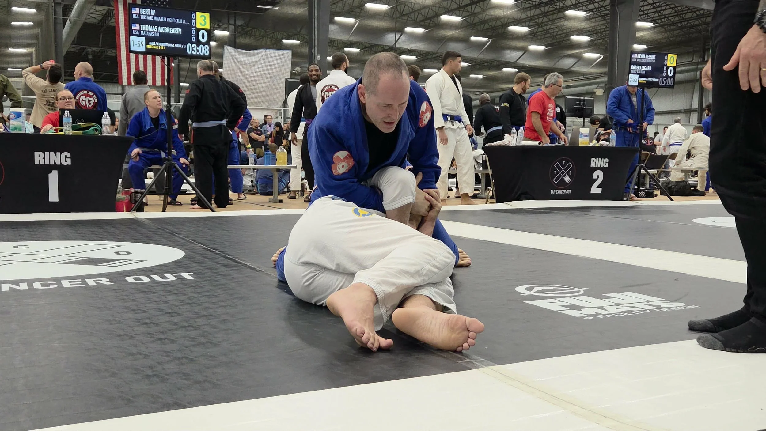 Marine Corps veteran Bert W. applying a submission hold during a BJJ competition match.