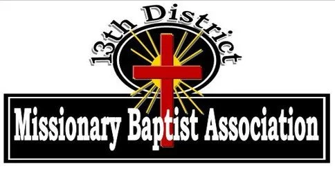 Logo for the 13th District Missionary Baptist Association featuring a red cross with a yellow starburst, and black and white text.