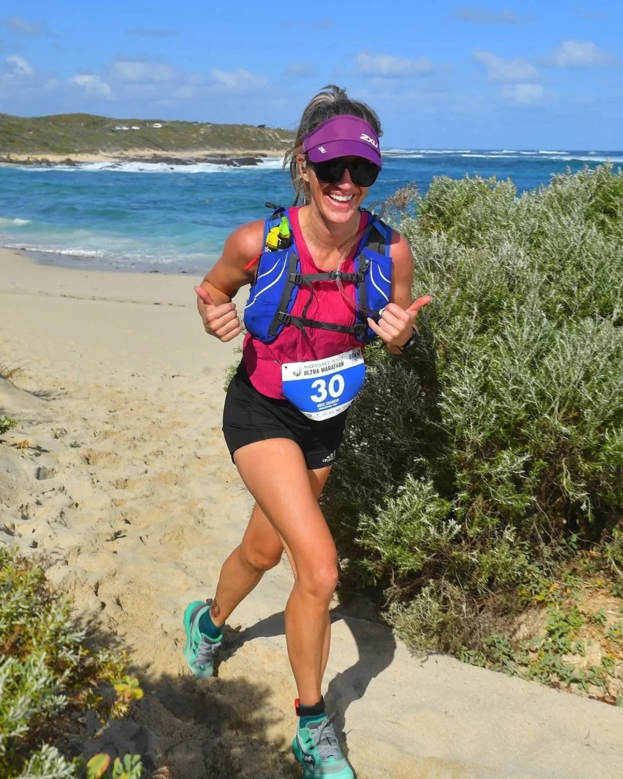 Female trail runner during the Margaret River Ultra Marathon on the Western Australian coast.