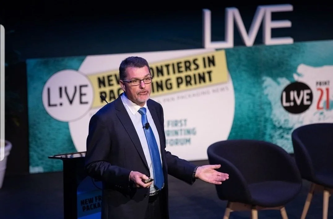Joe Foster speaking at a packaging industry conference