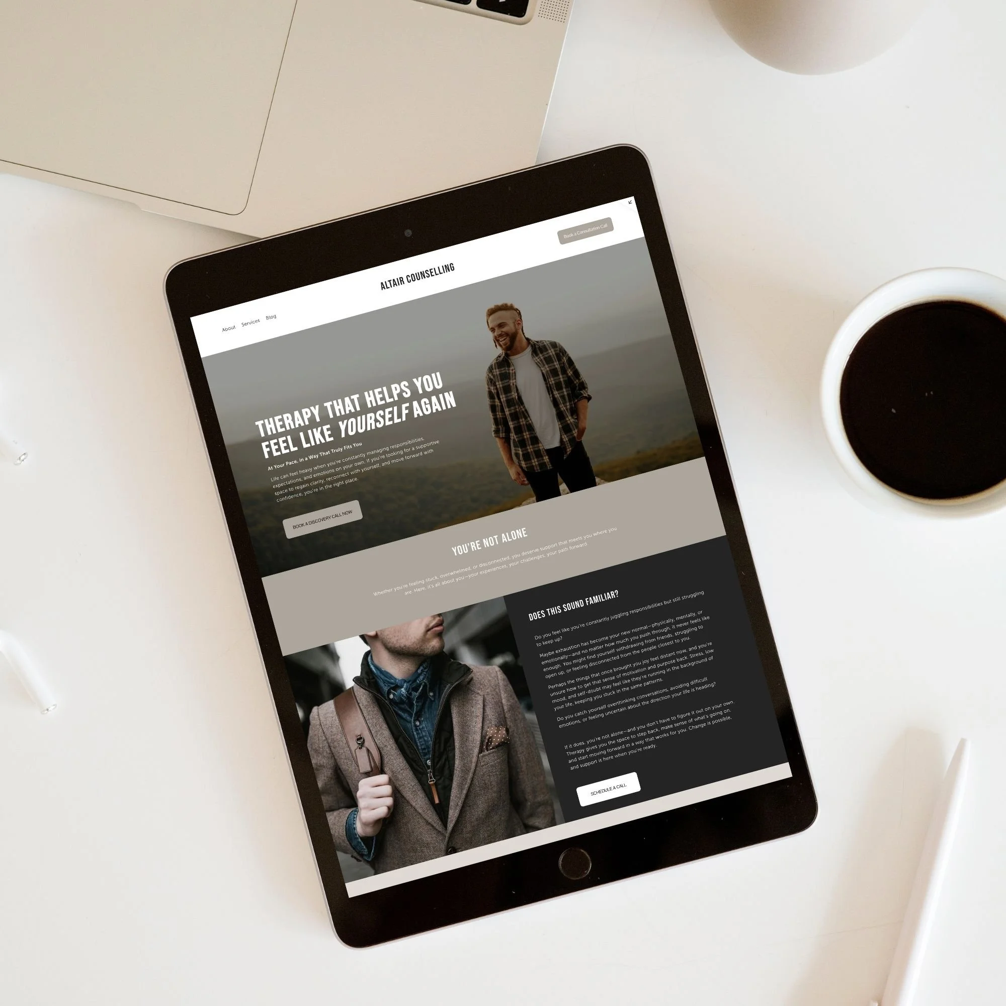 Tablet displaying Altair counseling website with a smiling man in an outdoor setting, and text about therapy and mental health.