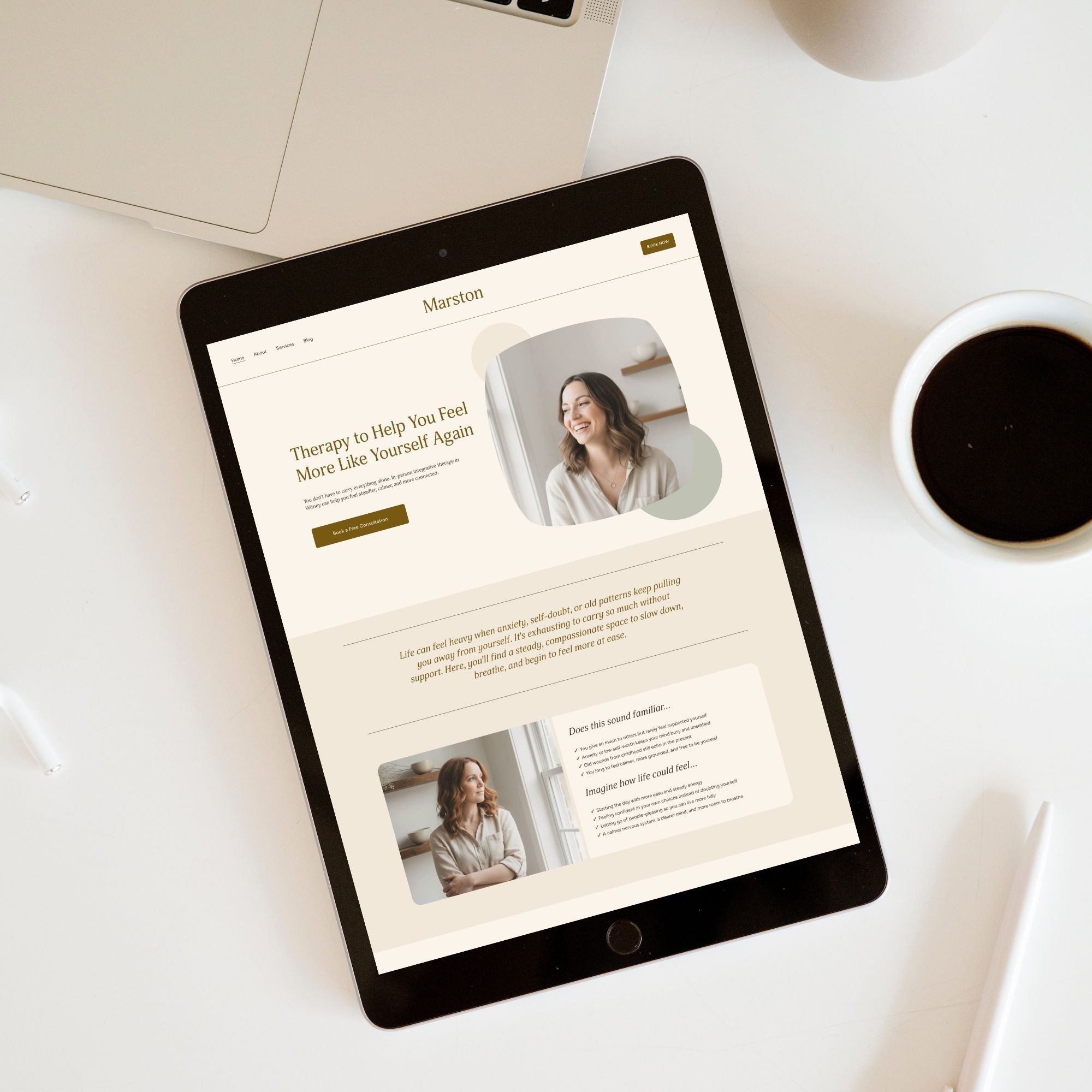 iPad displaying a therapy website template called Marston, with a smiling woman and text promoting therapy services, on a white desk alongside a cup of coffee, a laptop, white wireless earbuds, and a white pen.