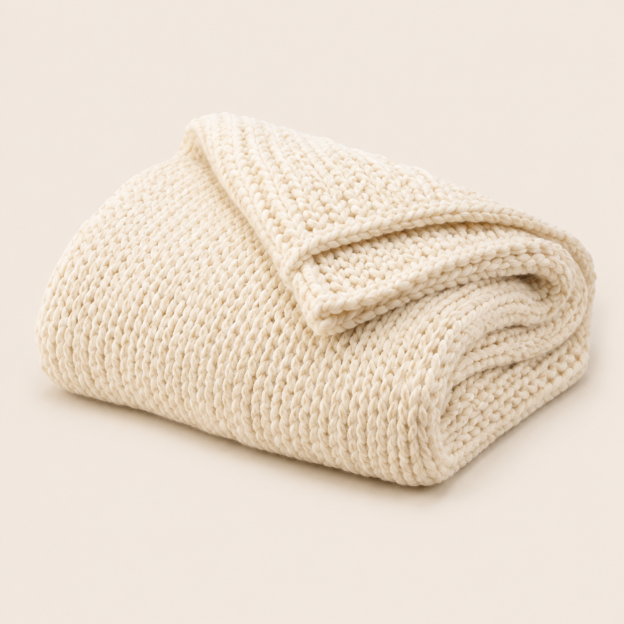 Grobstrick-Wohndecke in Creme