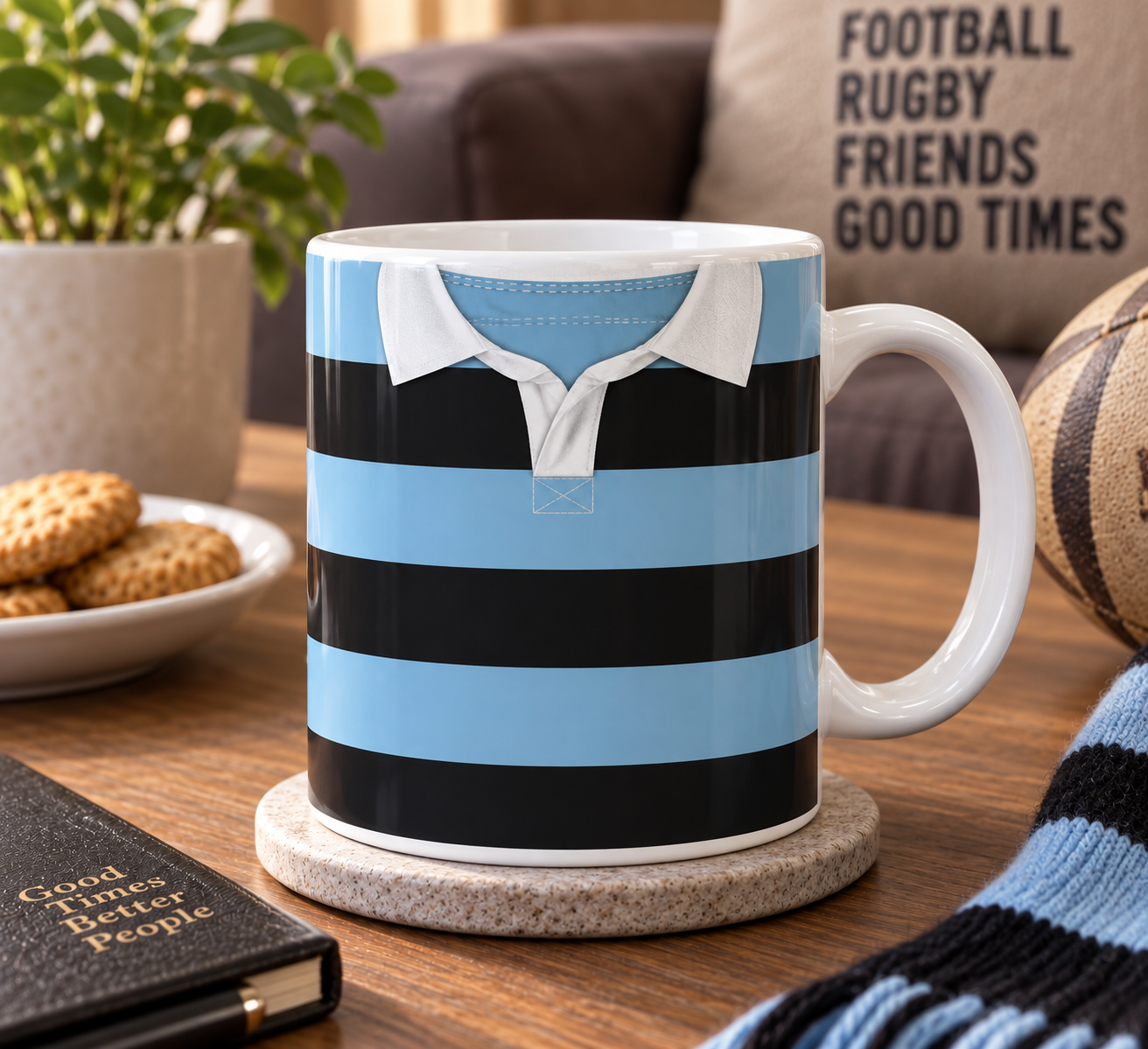 A coffee mug with a rugby shirt design, featuring a collar and horizontal stripes, placed on a wooden table with snacks, a plant, and a notebook nearby.