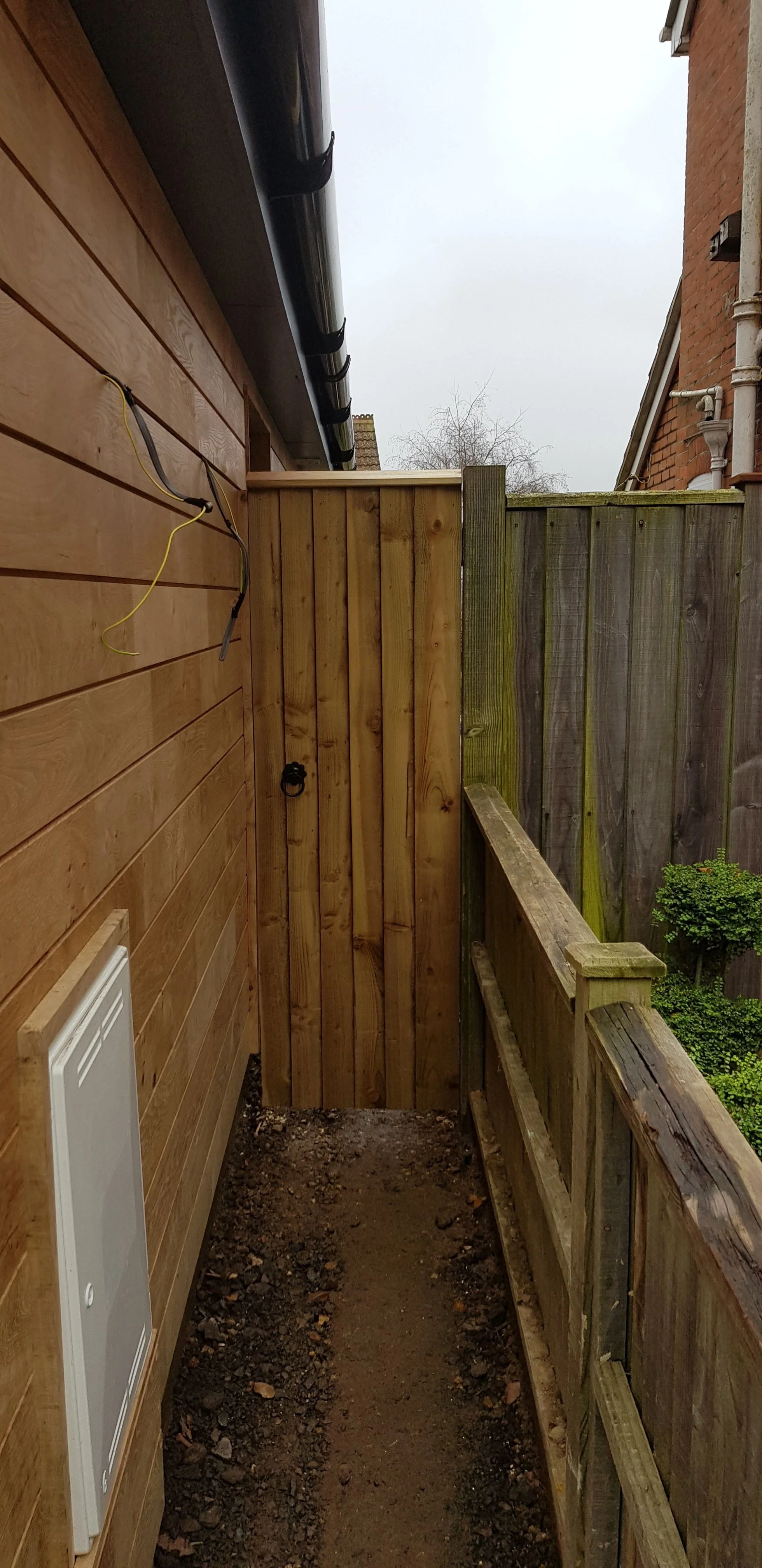 Oak cladding and custom gate