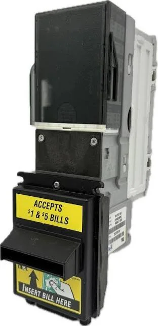 A bill acceptor machine with a yellow sign that reads 'Accepts $1 & $5 bills' and an empty bill insertion slot.