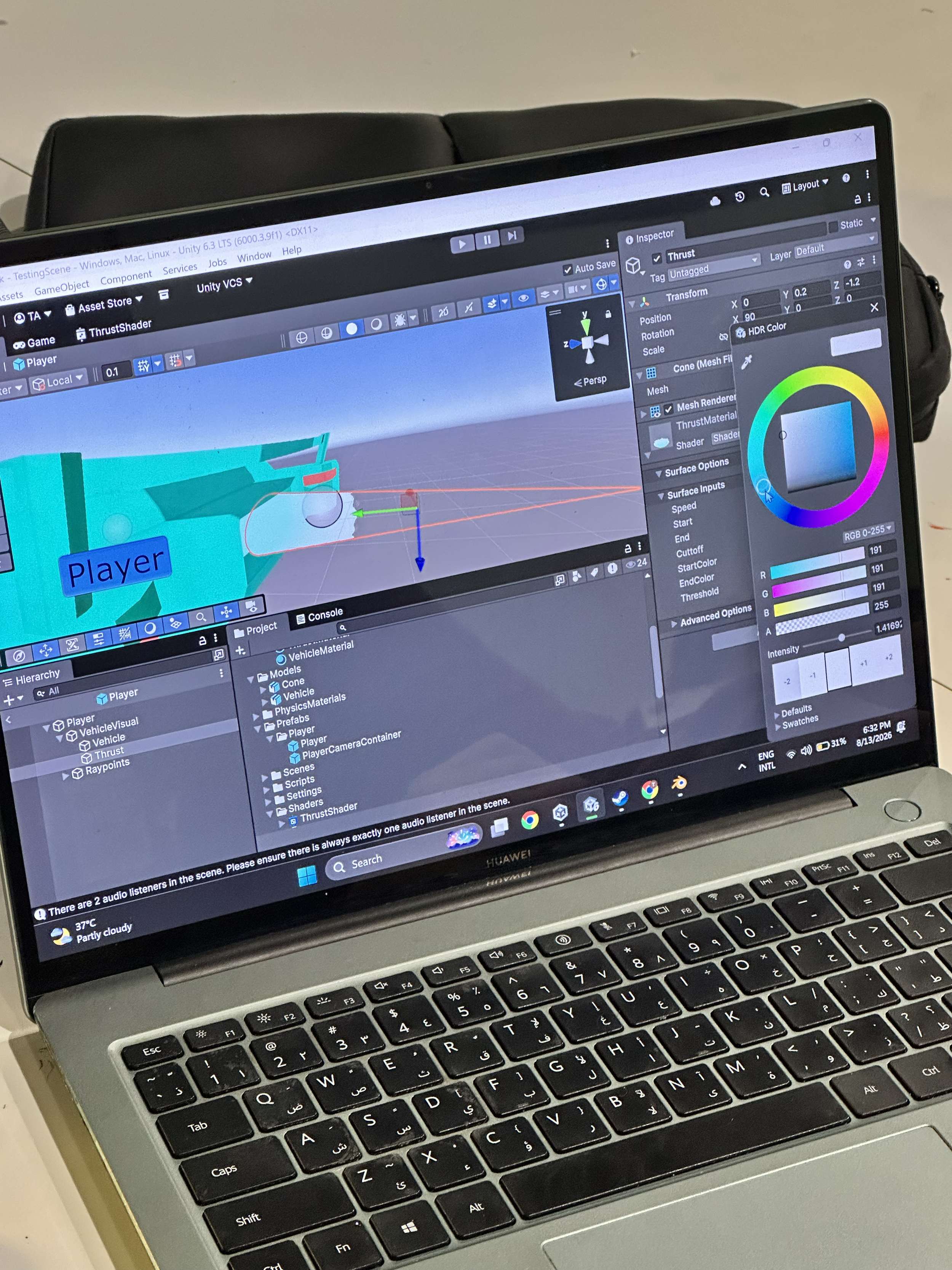 A laptop screen displaying a 3D modeling software interface. The software shows a 3D vehicle model with a blue 'Player' tag attached to it. The interface includes various editing options, color wheels, and a scene hierarchy panel on the left. The keyboard is visible below the screen, and the laptop appears to be a Huawei model.