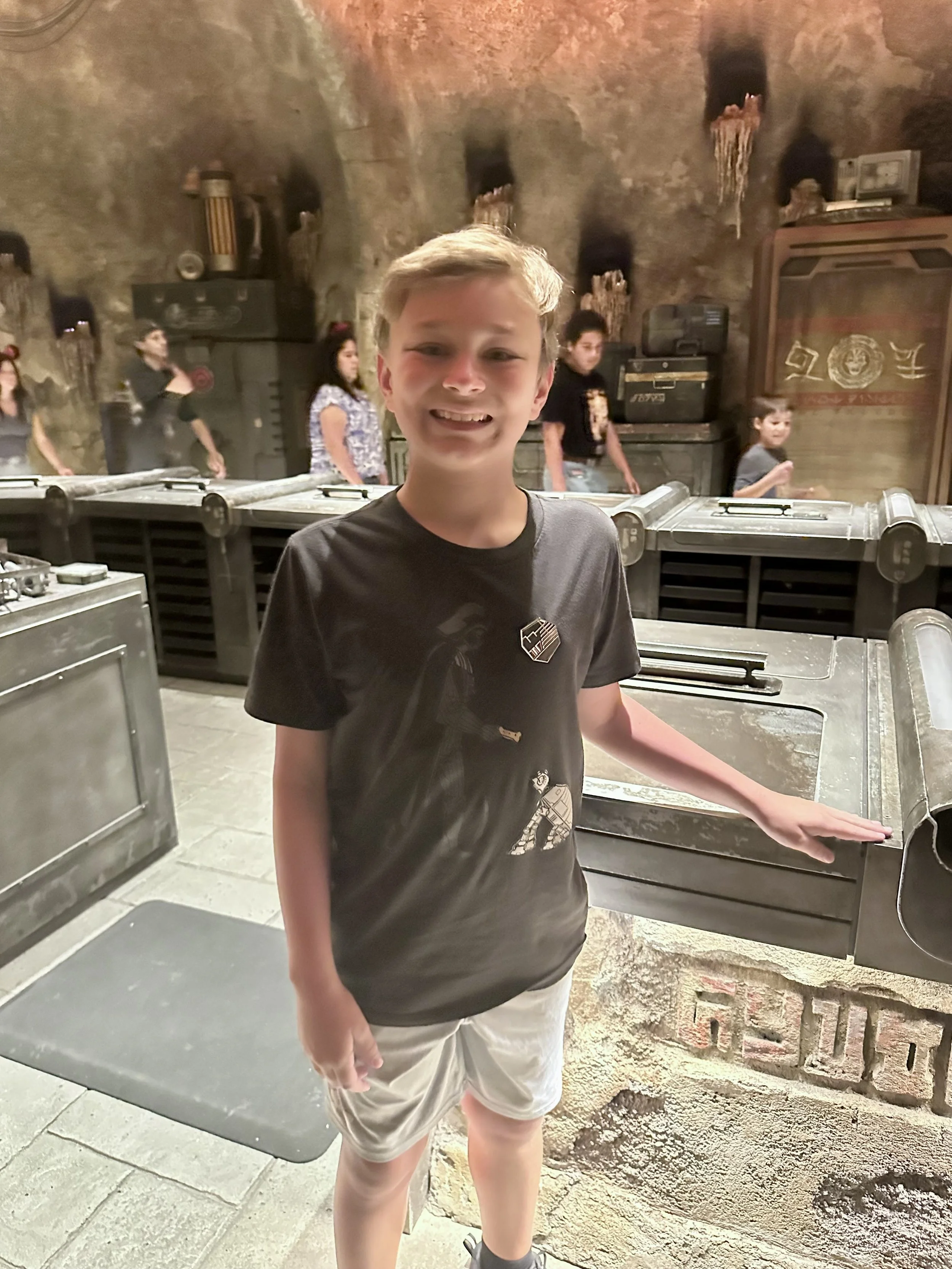 Building his own light saber at Savi's Workshop in Galaxy's Edge at Disneyland in California. 