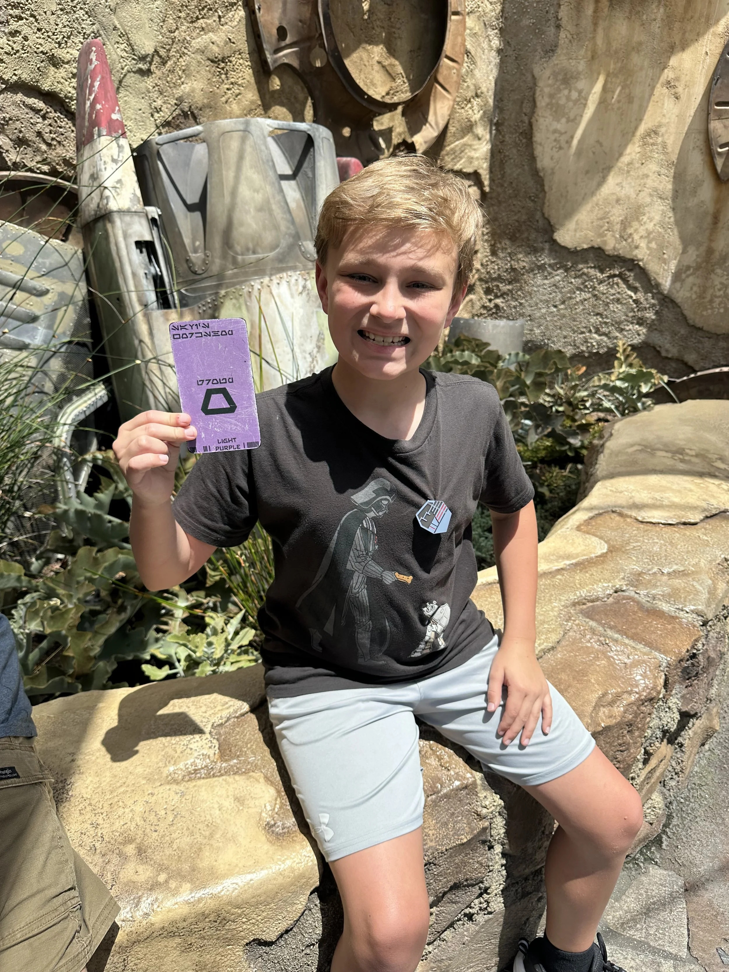 Waiting to build his own light saber at Savi's Workshop in Galaxy's Edge at Disneyland in California.
