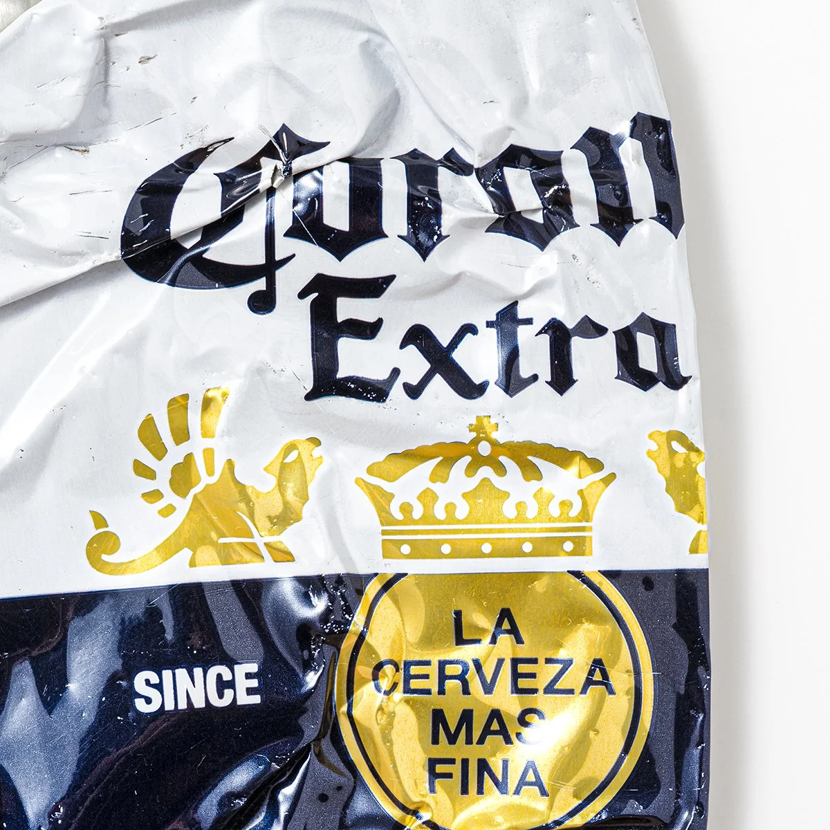 Corona can crushed zoomed.jpg