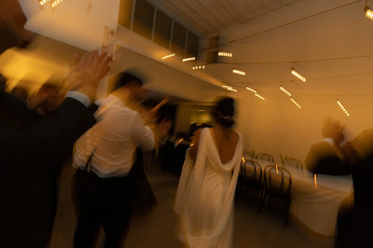 Guests dancing together at night during a wedding reception inside a Toronto studio rental space and event venue 