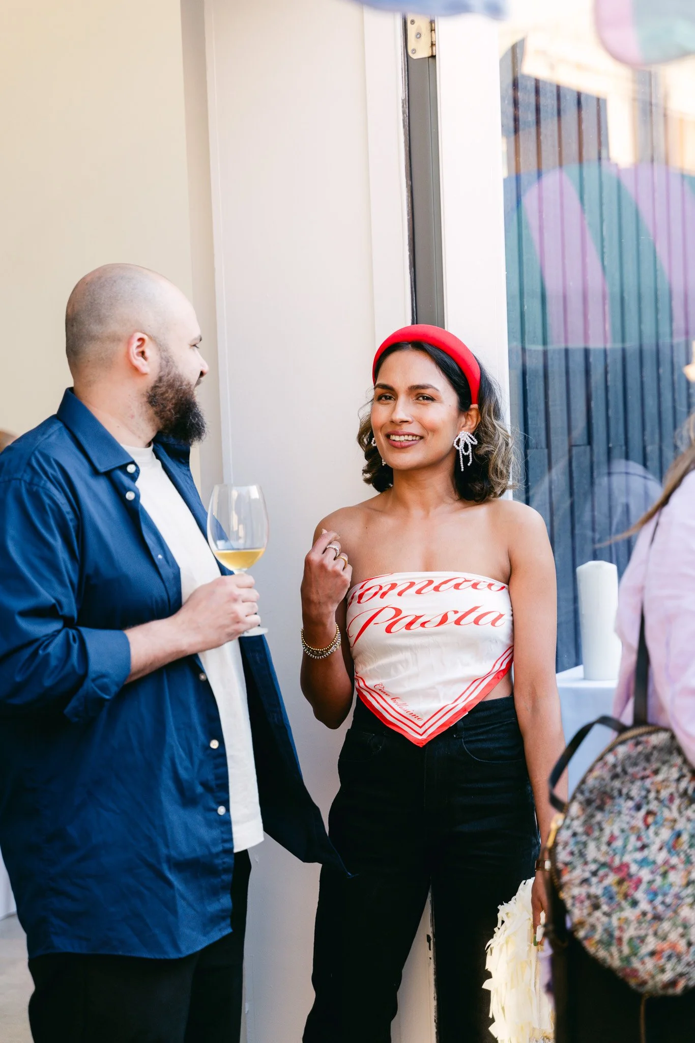 Two people having a conversation inside a Toronto event venue rental space.