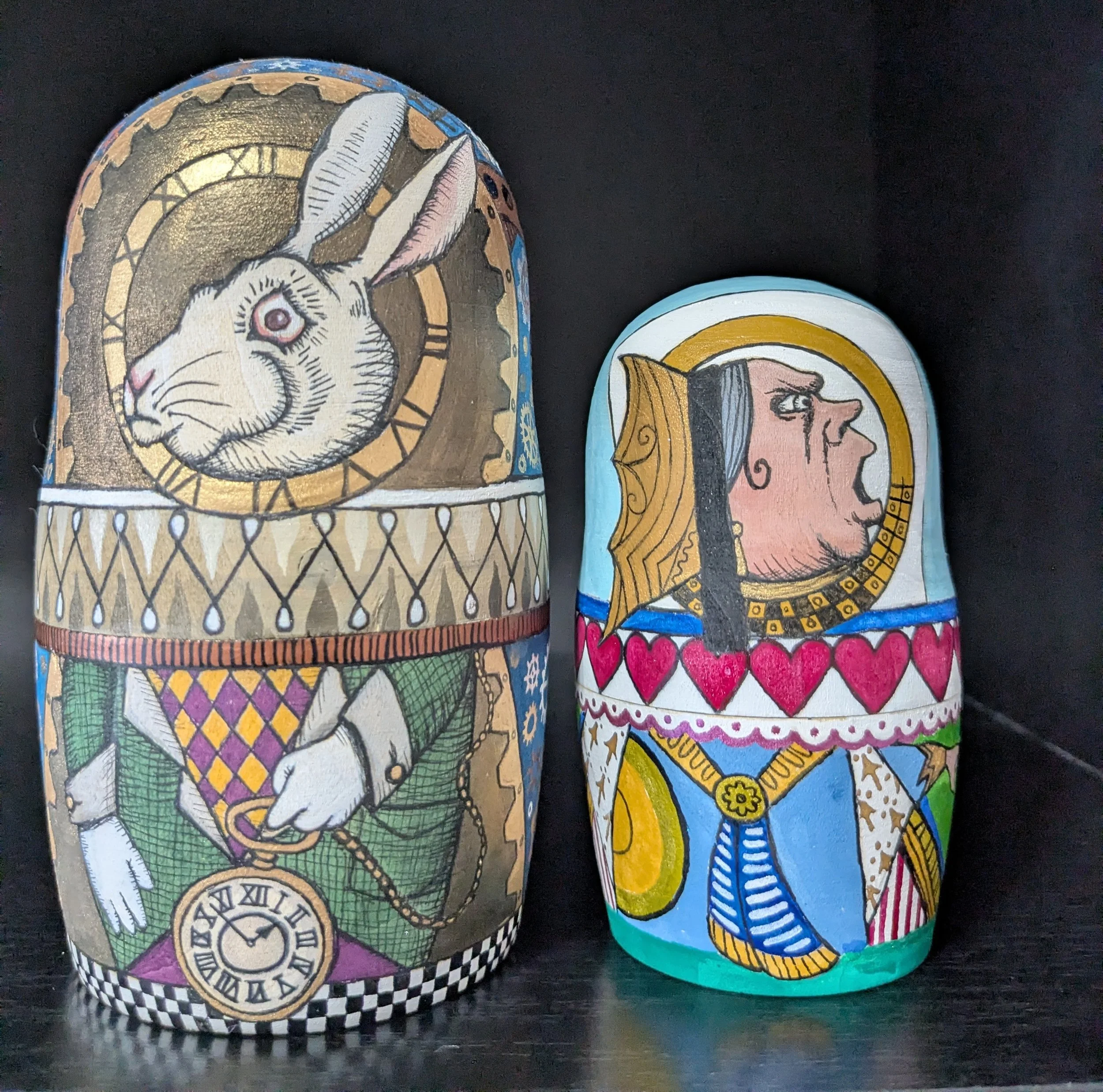 "Alice's Adventures in Wonderland" themed Russian nesting dolls.
India ink on wooden blank dolls.
A work in progress.