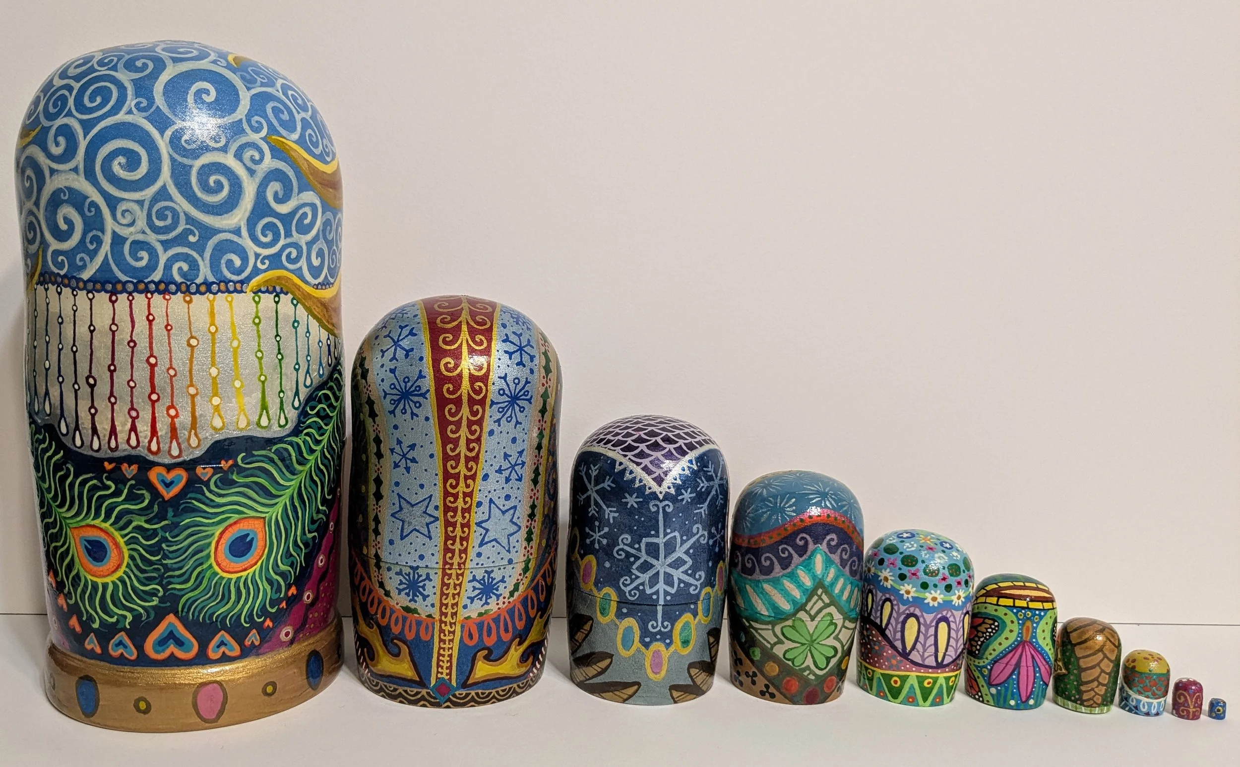 (Backside) "Pagan Wheel of the Year, personified" themed Russian nesting dolls.
India ink on wooden blank dolls.
2025.