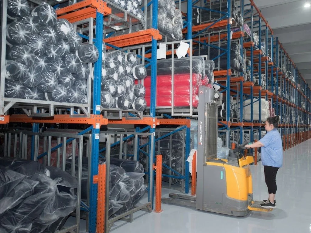 Novweave bulk fabric warehouse storing packaged linen rolls and raw materials for global B2B custom orders and fast dispatch.