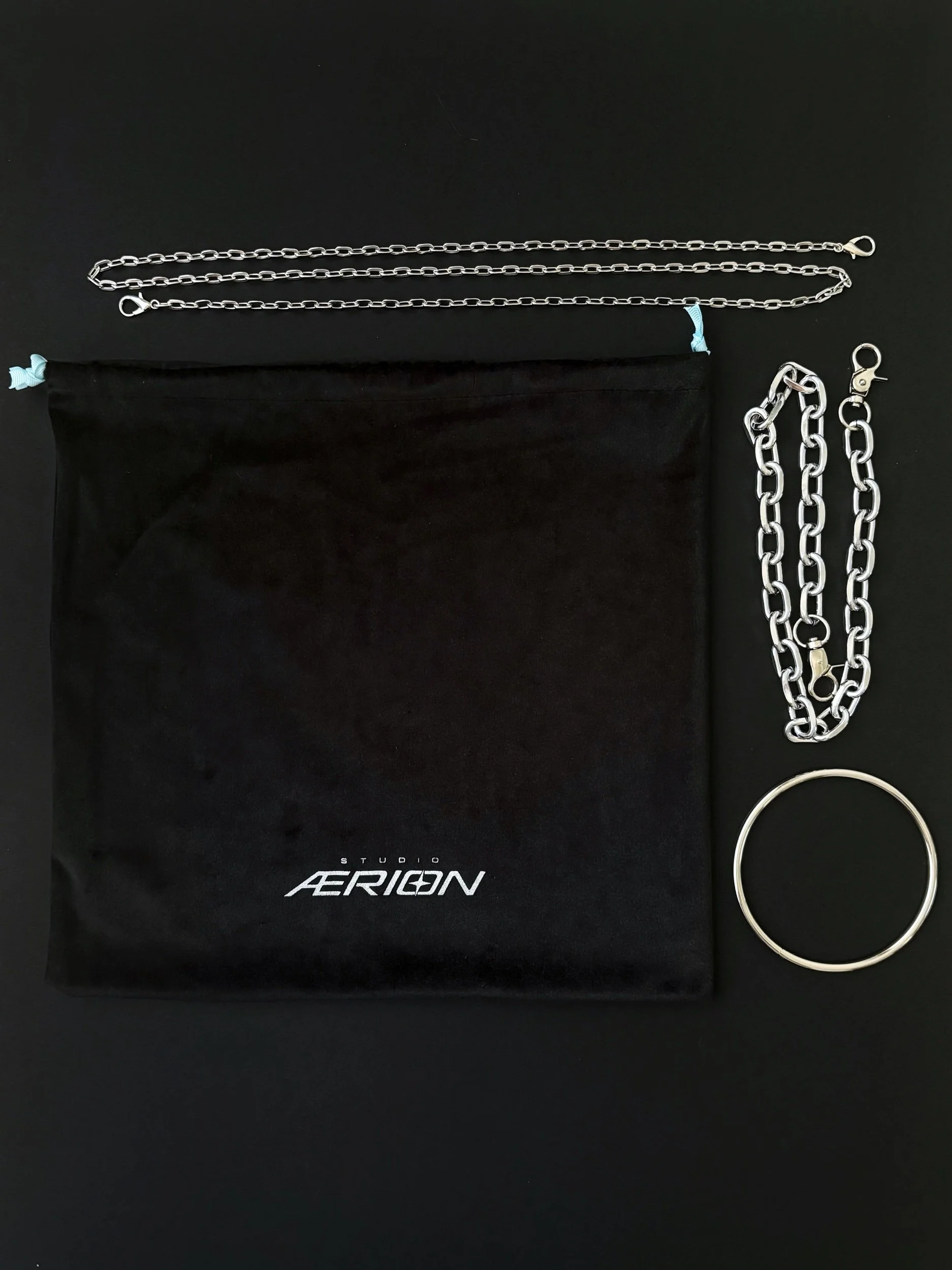 Black velvet dust bag with detachable long cross body chain and chunky silver chain strap