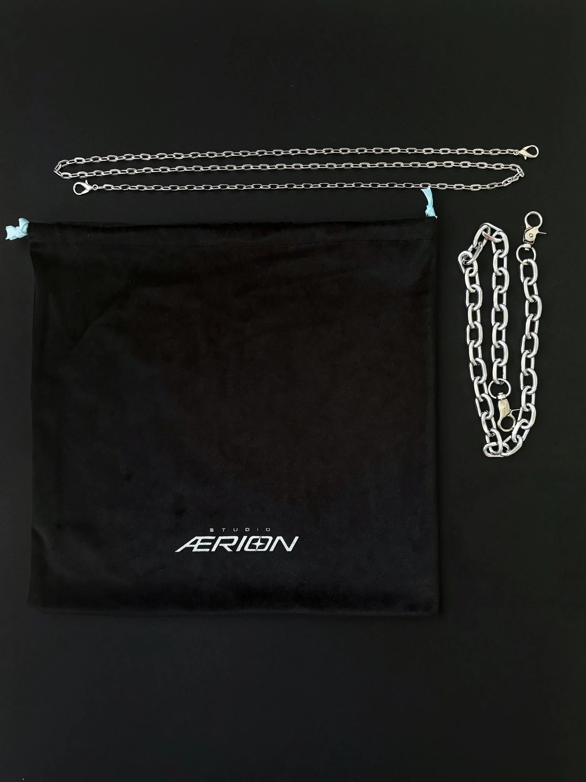 Black velvet dust bag with detachable long cross body chain and chunky silver chain strap