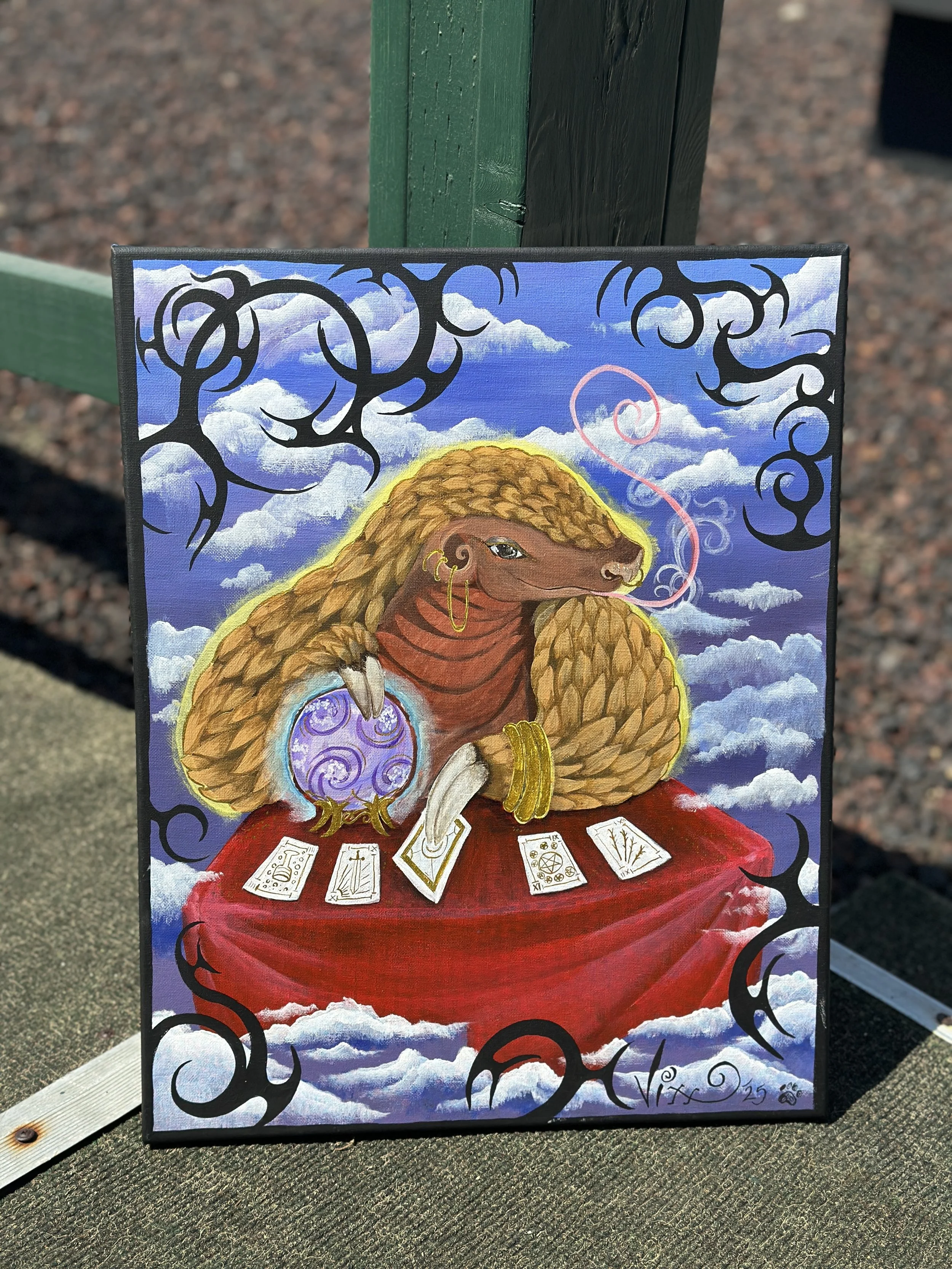 A colorful painting of a dog with curly fur, sitting at a table with tarot cards, holding a crystal ball, surrounded by clouds and decorative swirls.