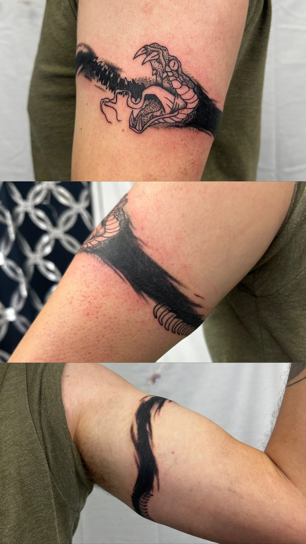 Tattoo of a dinosaur's head, possibly a T-Rex, on upper arm, with shading and black ink details.
