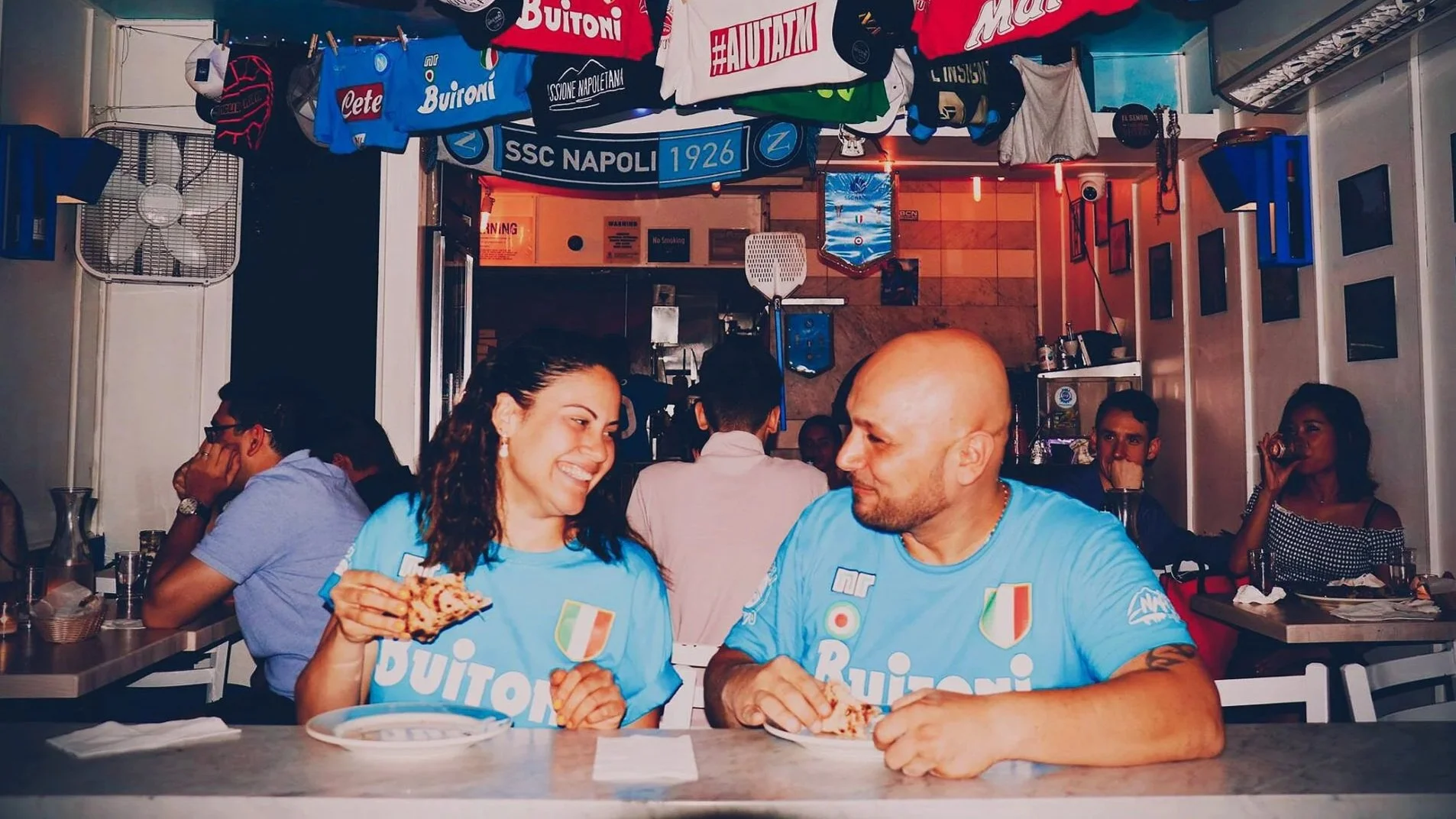 Austria and Ciro sharing a pizza at the first location in West Village