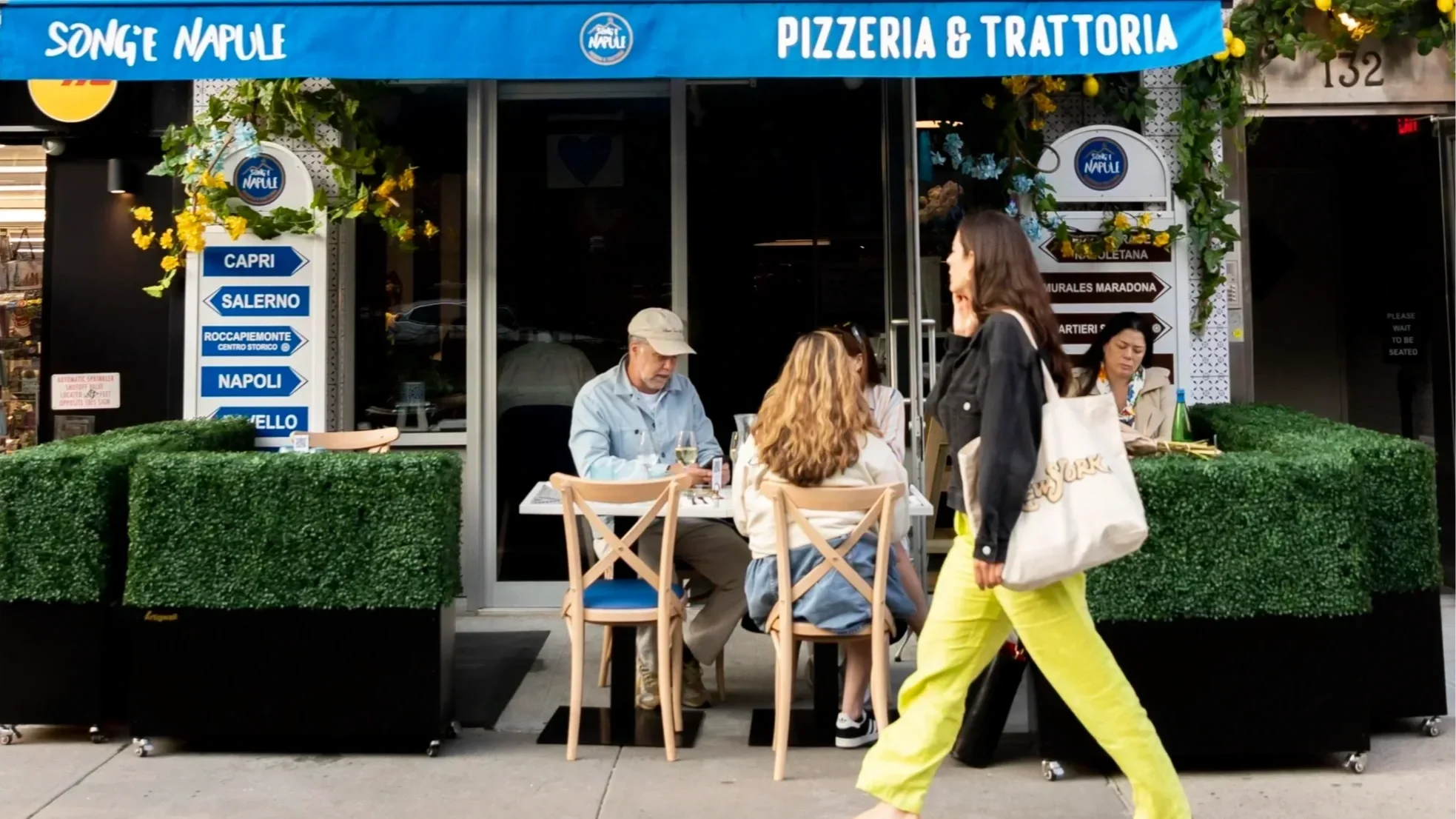 Front view and outdoor seating of our West Village location