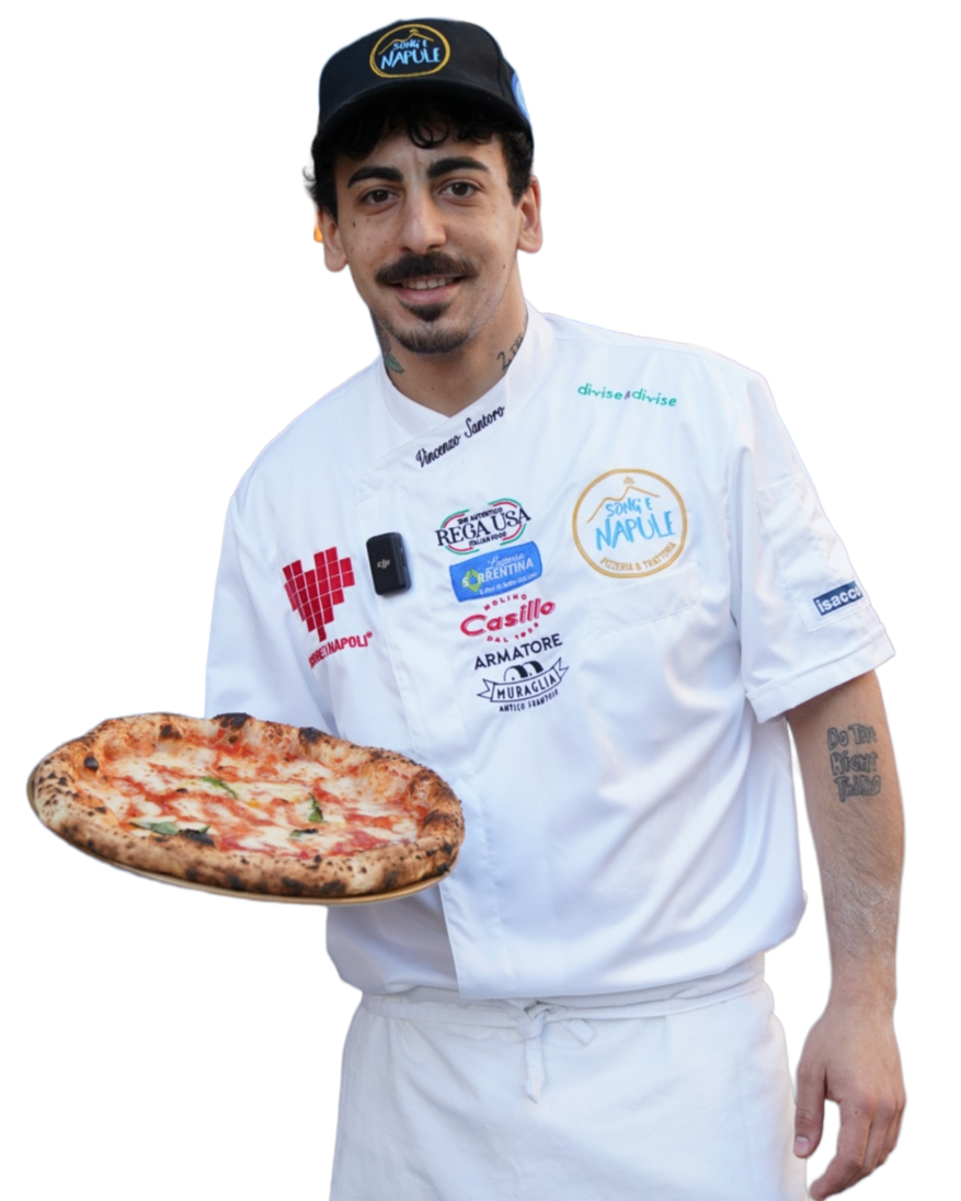 Pizzaiolo Vincenzo Santoro smiling and holding a margherita pizza