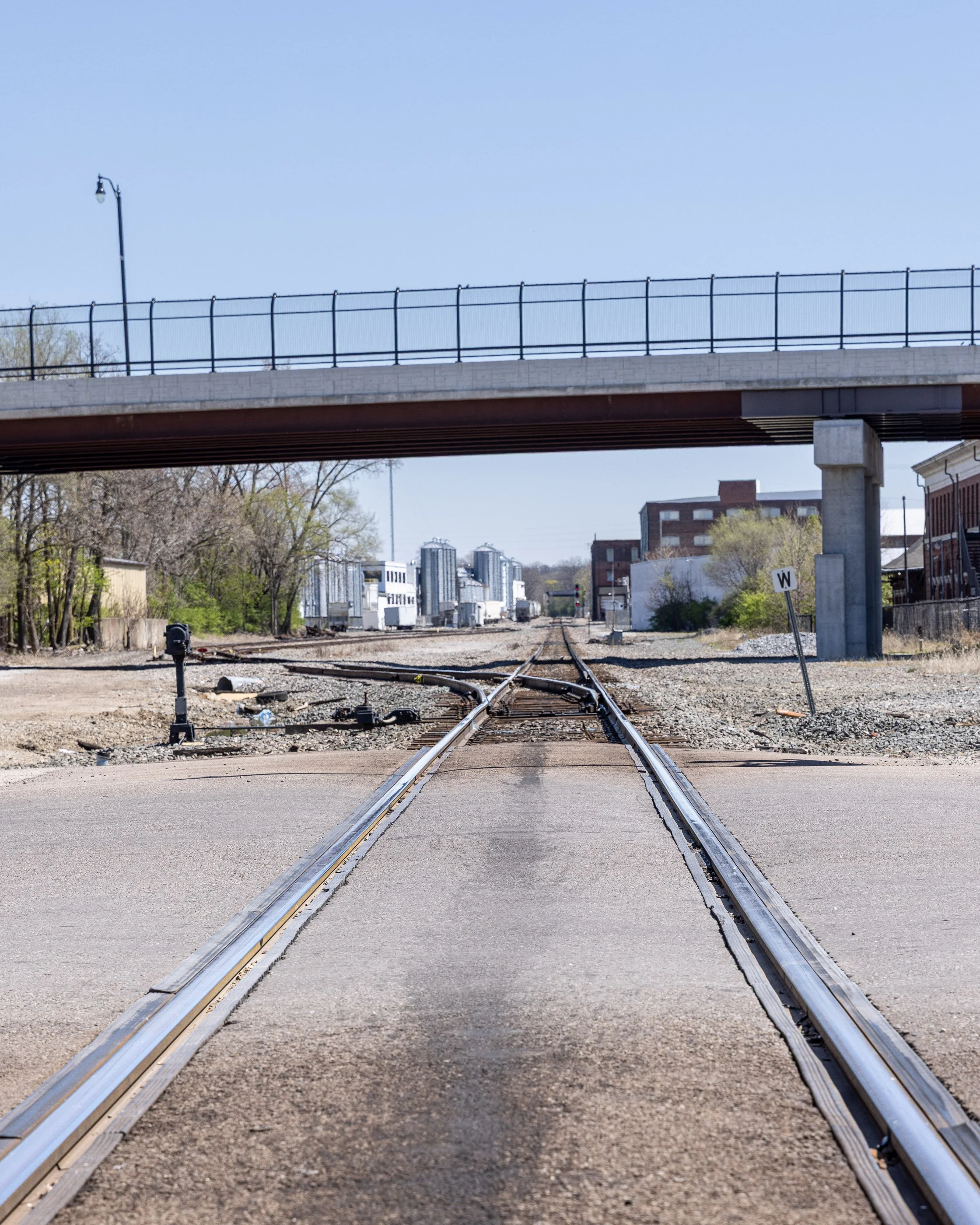 Railroad tracks curve through an industrial corridor beside the former Starr Piano grounds in Richmond.