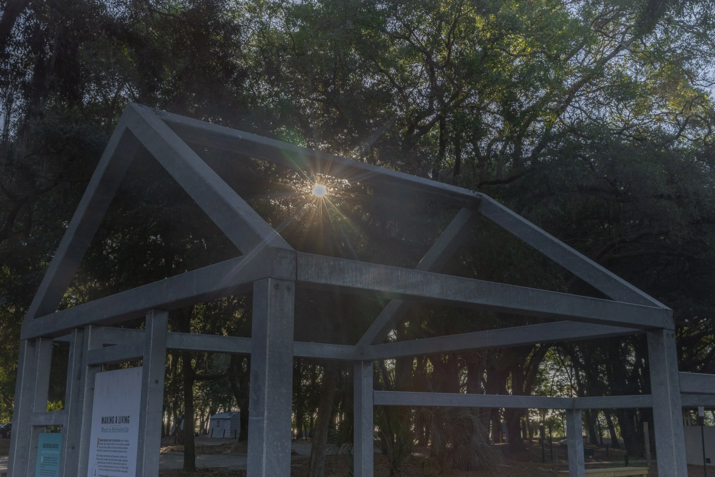 Morning light passes through a Ghosted Structure at Historic Mitchelville Freedom Park. Rather than reconstructing the vanished buildings, the installation outlines their scale and leaves visitors to supply the walls, rooms, and lives once held insid