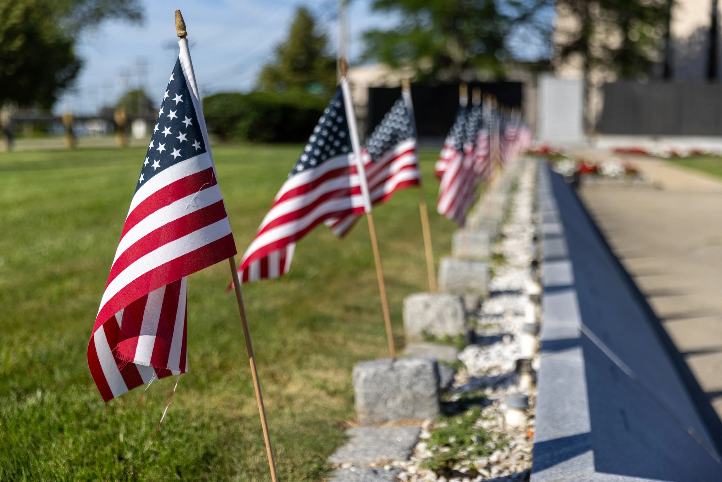 Small American flags line the granite markers at the National Submarine Memorial East in Groton. The memorial honors the 3,617 submariners and fifty-two U.S. submarines lost during World War II.