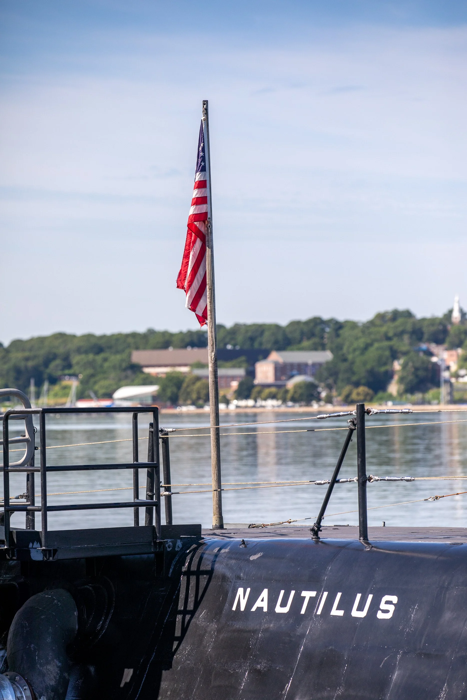 An American flag flies above the deck of USS Nautilus at the Submarine Force Museum in Groton. Built nearby at Electric Boat and launched into the Thames in 1954, the pioneering submarine eventually returned to the river where her history began.
