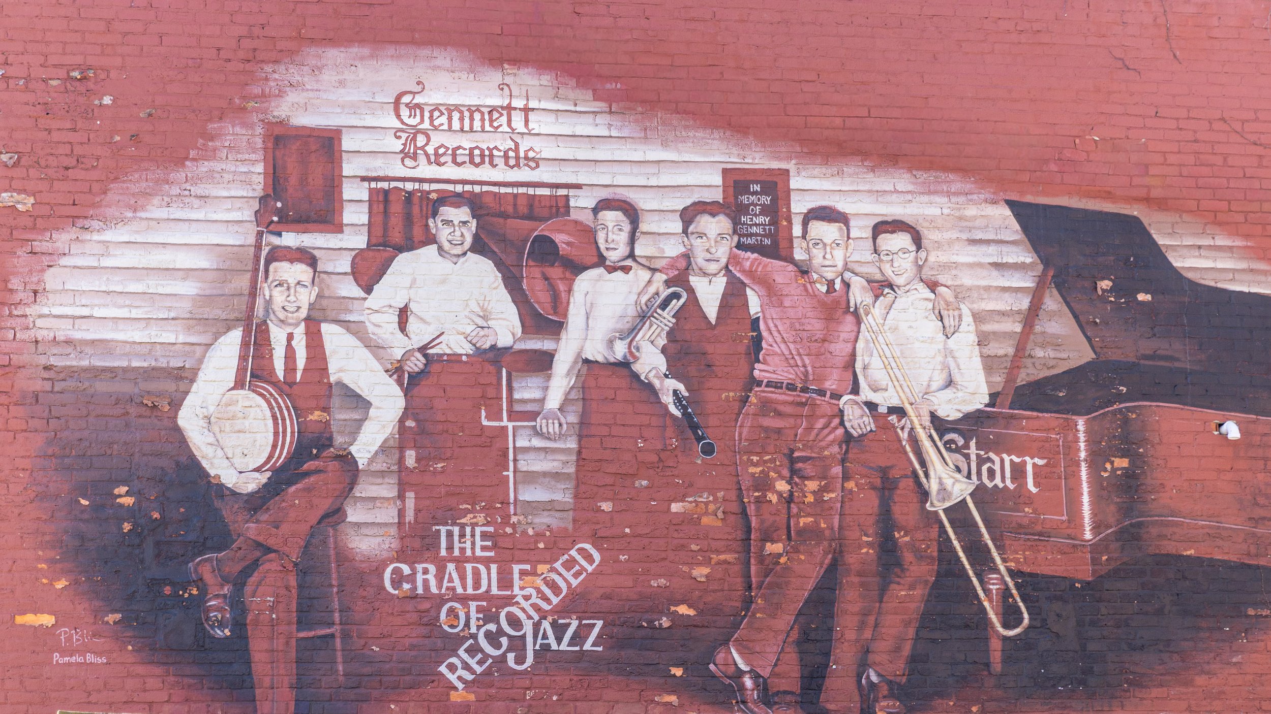 A mural depicts an early jazz ensemble beside a Starr piano beneath the words “The Cradle of Recorded Jazz.”