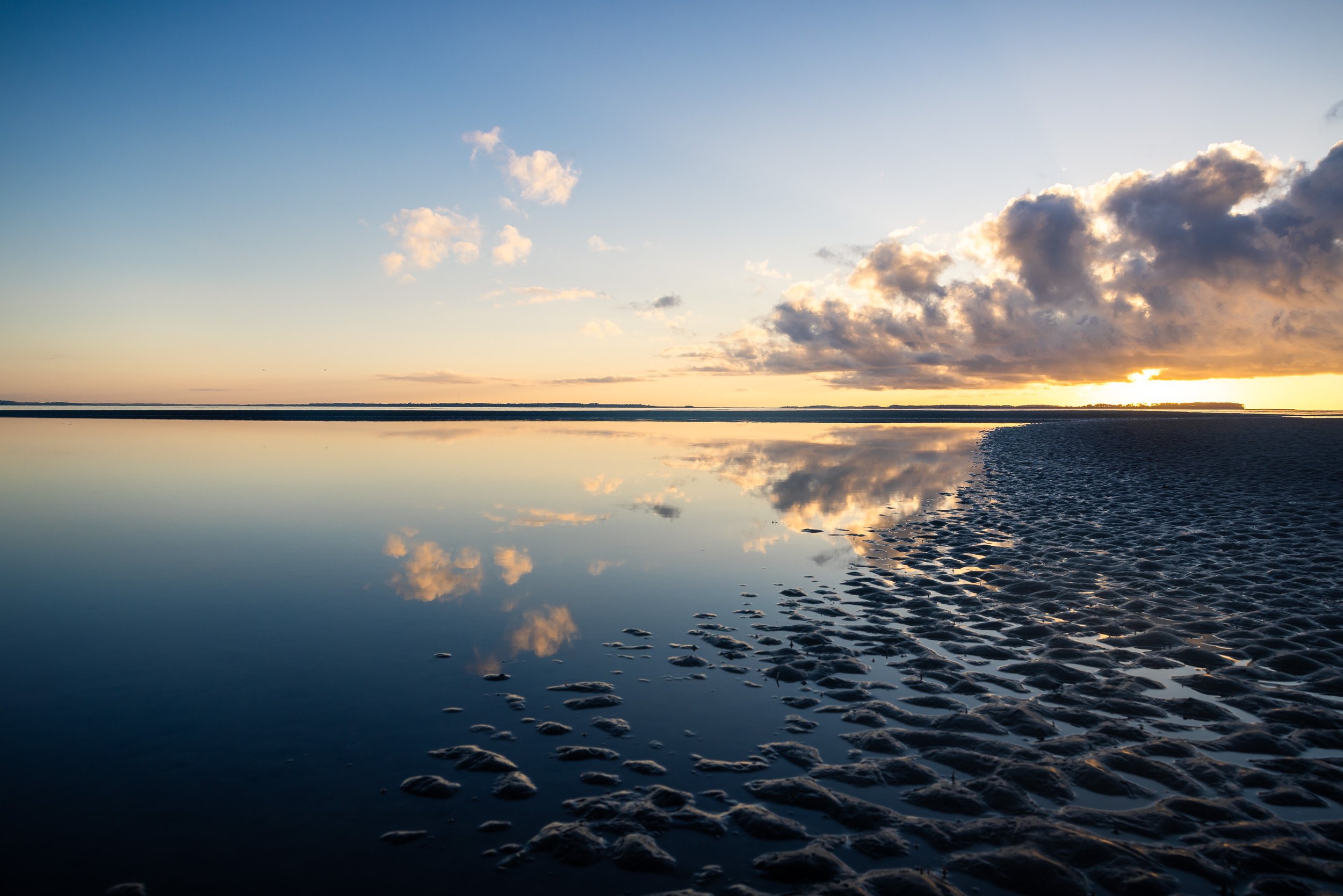 Port Royal Sound before sunrise, with the horizon beginning to brighten over the water.