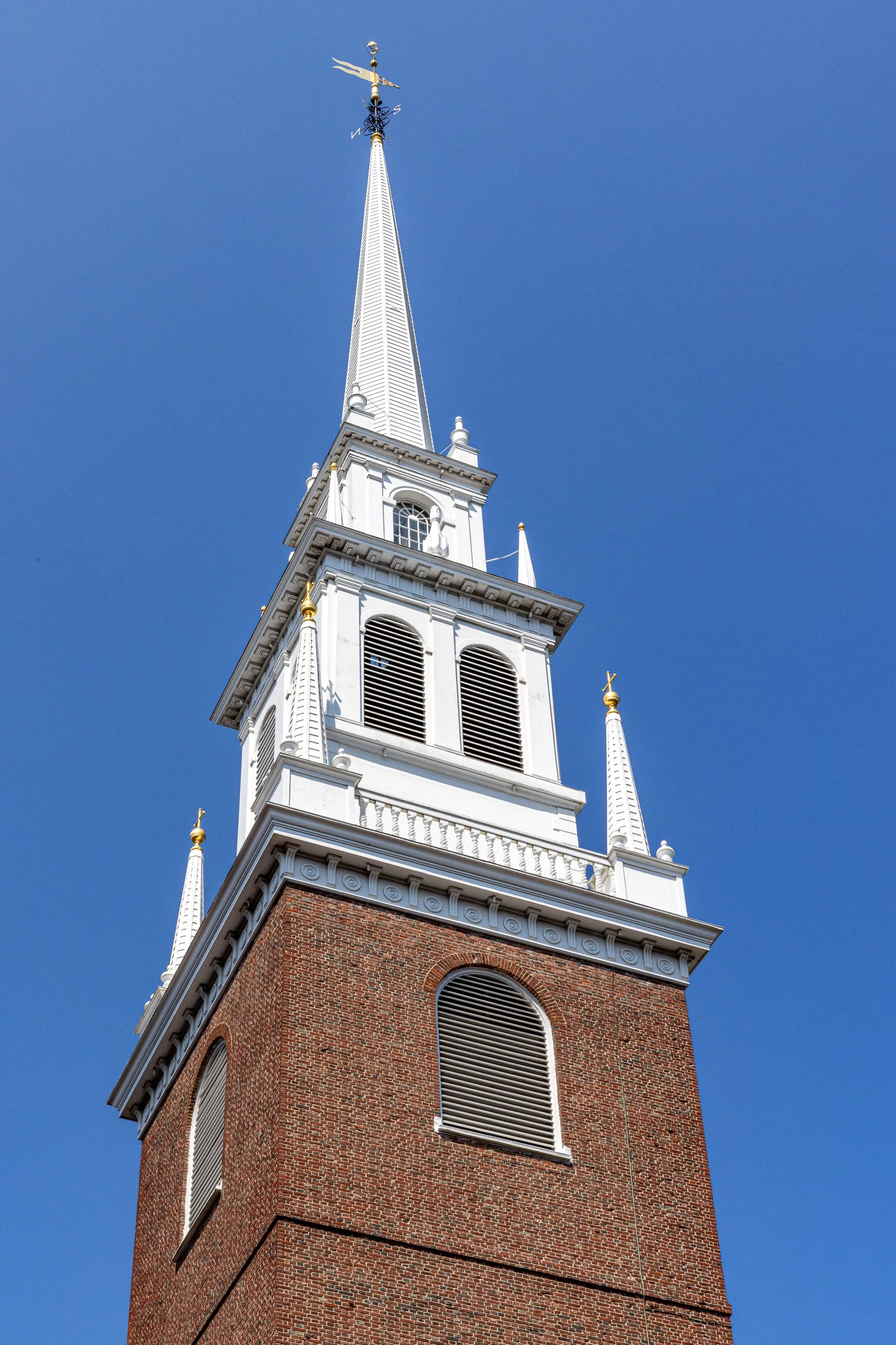 Old North Church’s steeple rises above Boston’s North End. It’s the church’s third steeple. Storms took down the first in 1804 and the second in 1954. The original 1740 weathervane survived both and still sits on top today.