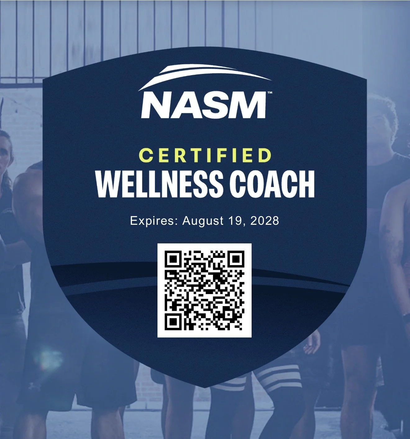 NASM Certified Wellness Coach card with expiration date August 19, 2028 and a QR code, worn by people in athletic gear, standing in front of a blue wooden fence.
