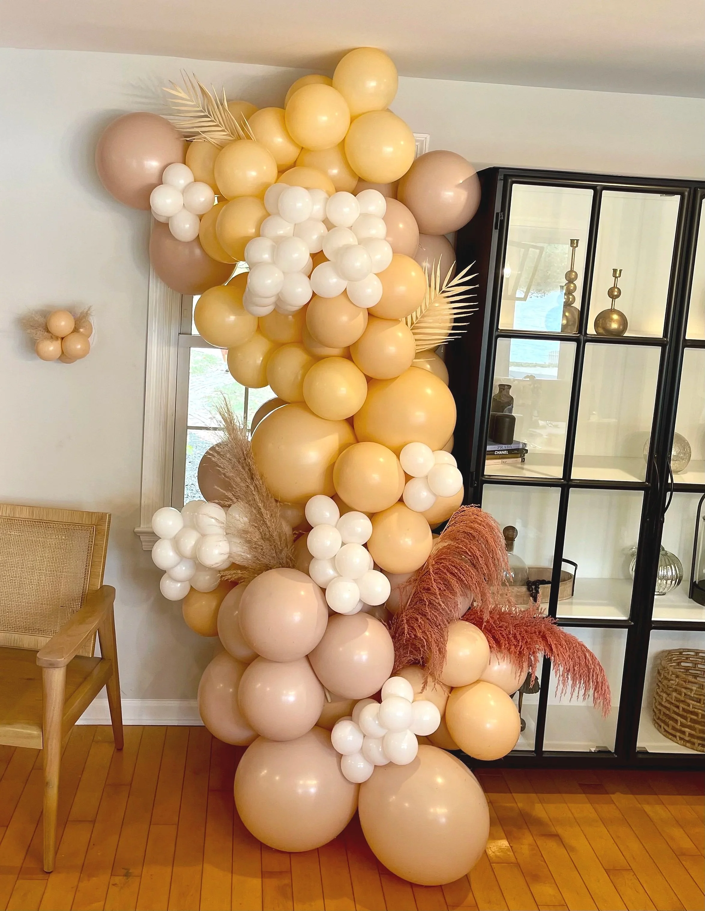 Blush and gold balloon garland installation for a bridal shower by Wildly Pretty Events