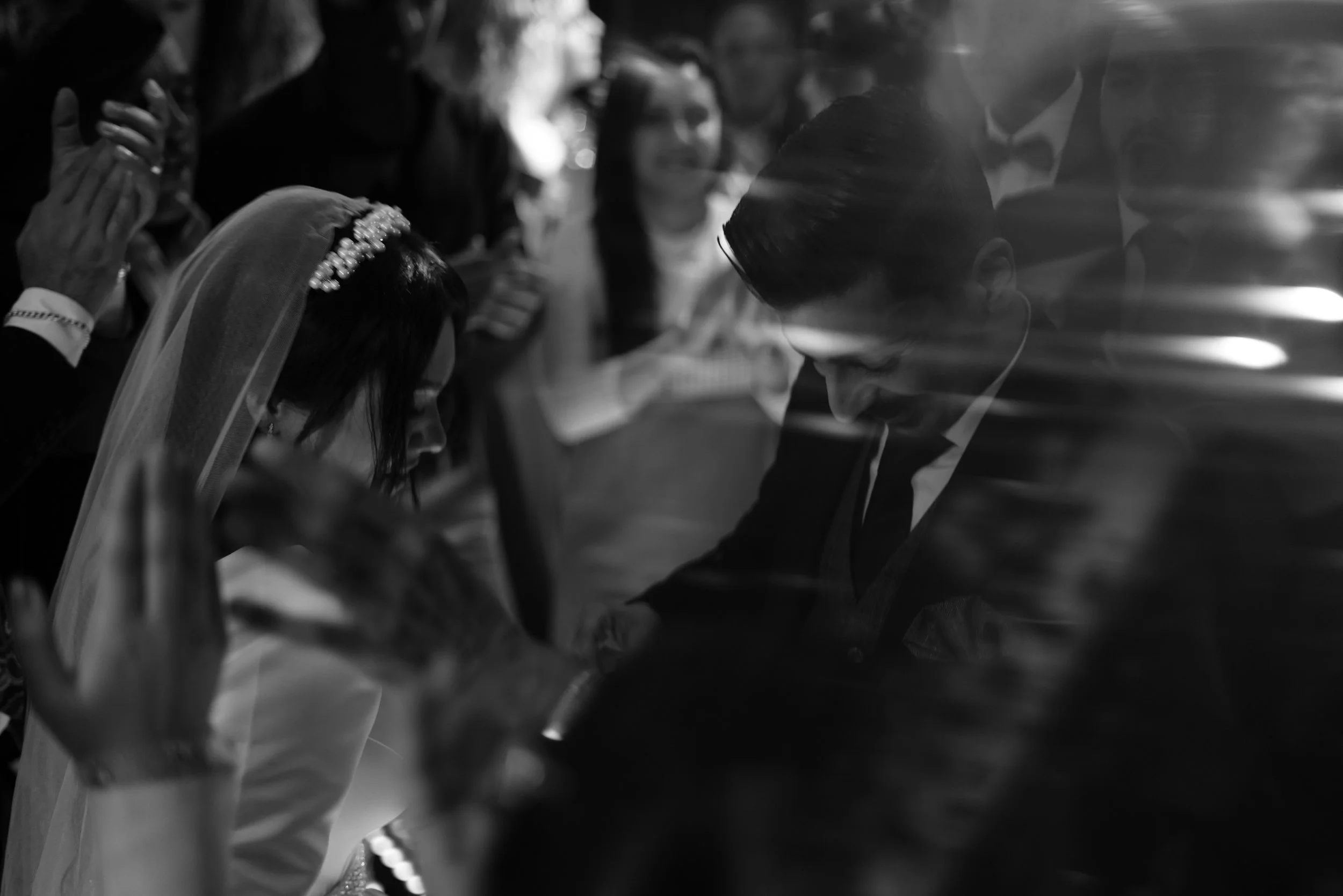 Black and white photo of a bride and groom in a close moment during an intimate wedding ceremony in the Washington DC area.