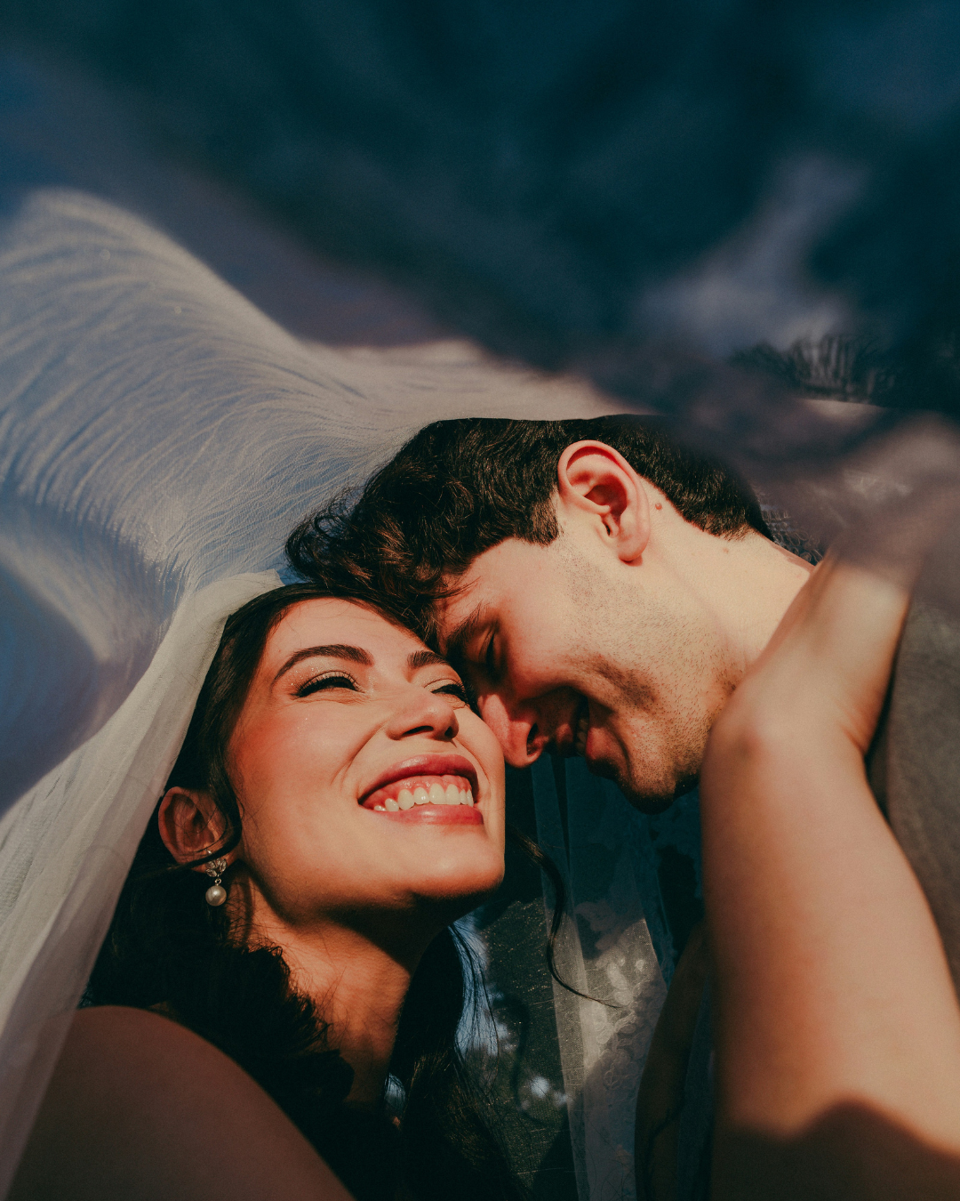 Romantic wedding couple under a veil during an intimate wedding coordinated by Dream Out Loud Studio in the Washington DC area.