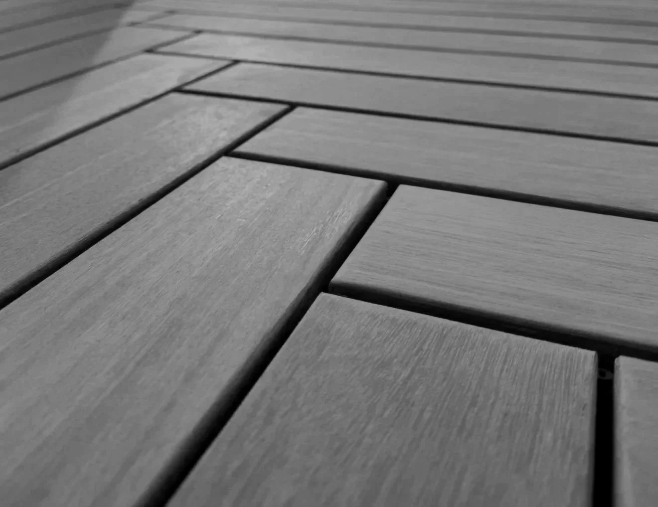 Herringbone pattern mahogany deck boards secured with hidden clips