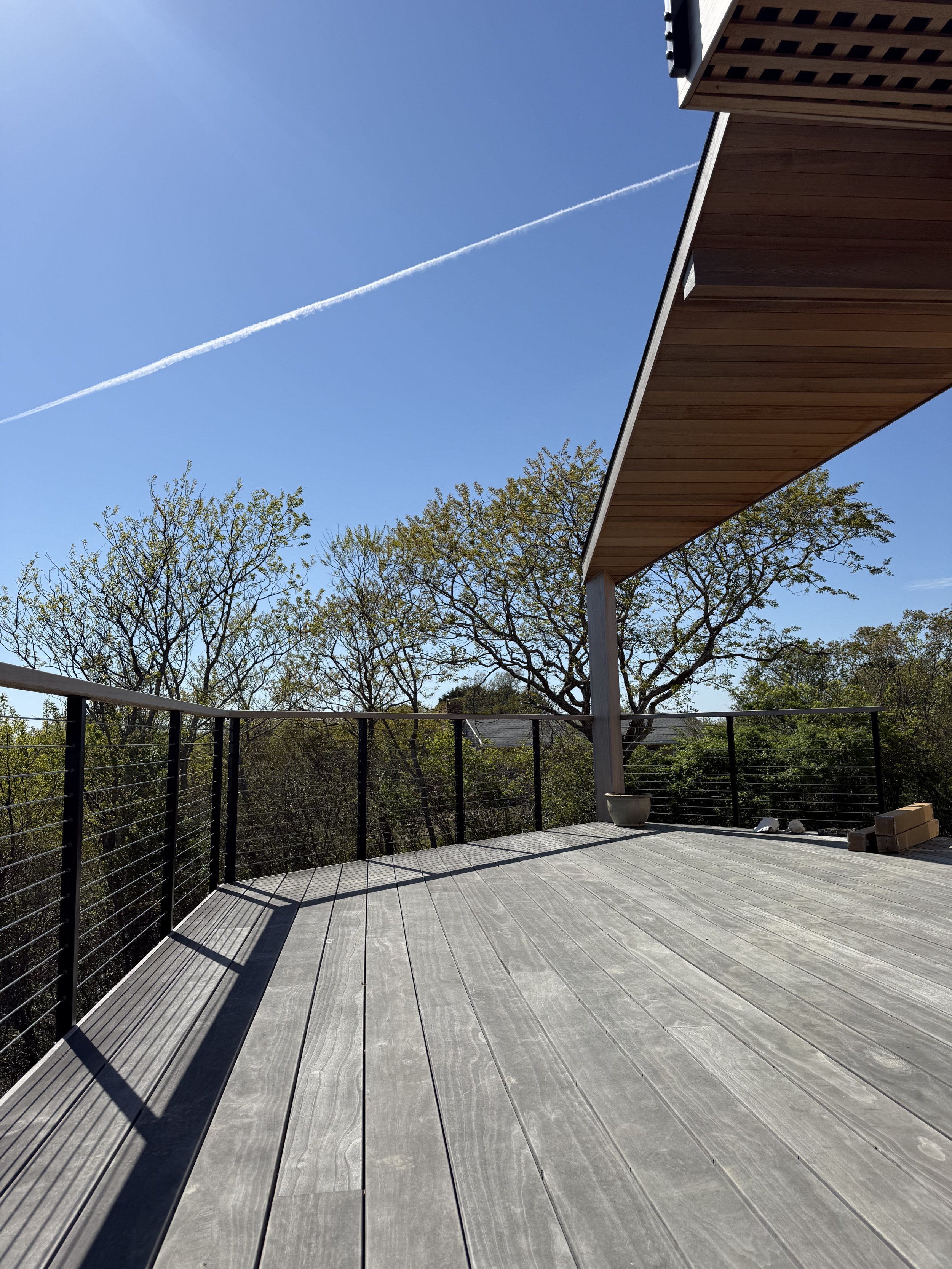 Block Island ASccoya deck fastened with Camo Marksman with Atlantis stainless cable rails with side mounted posts and western red cedar drink rail 